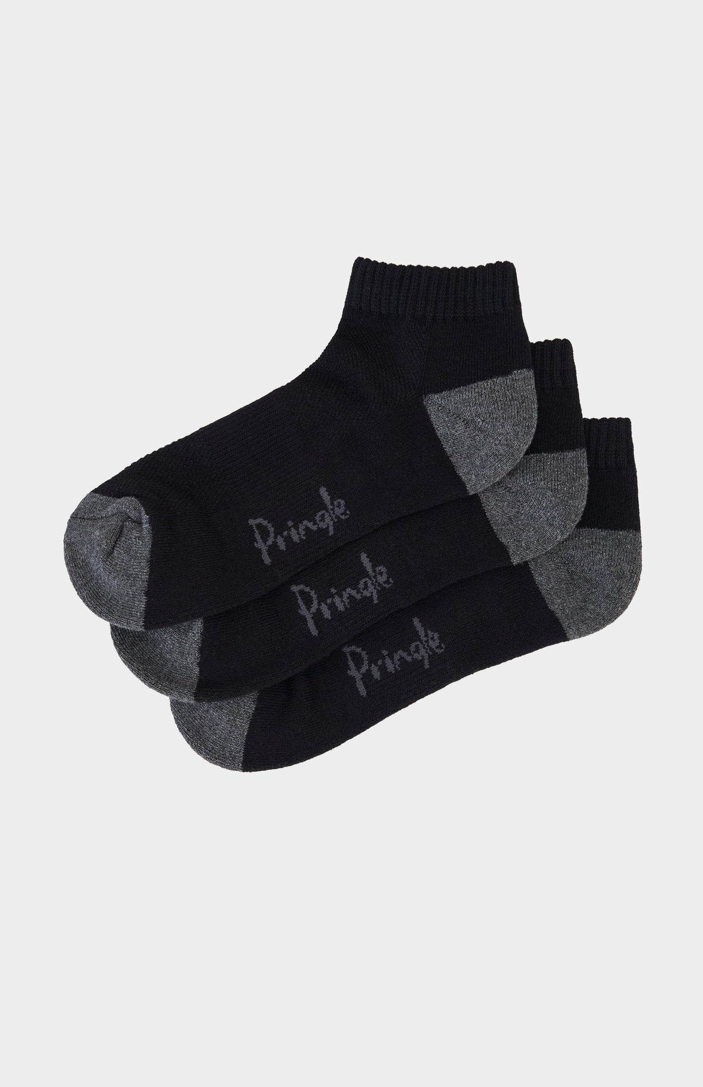 Three pairs of black socks with gray accents and 'Pringle' branding on a light gray background.