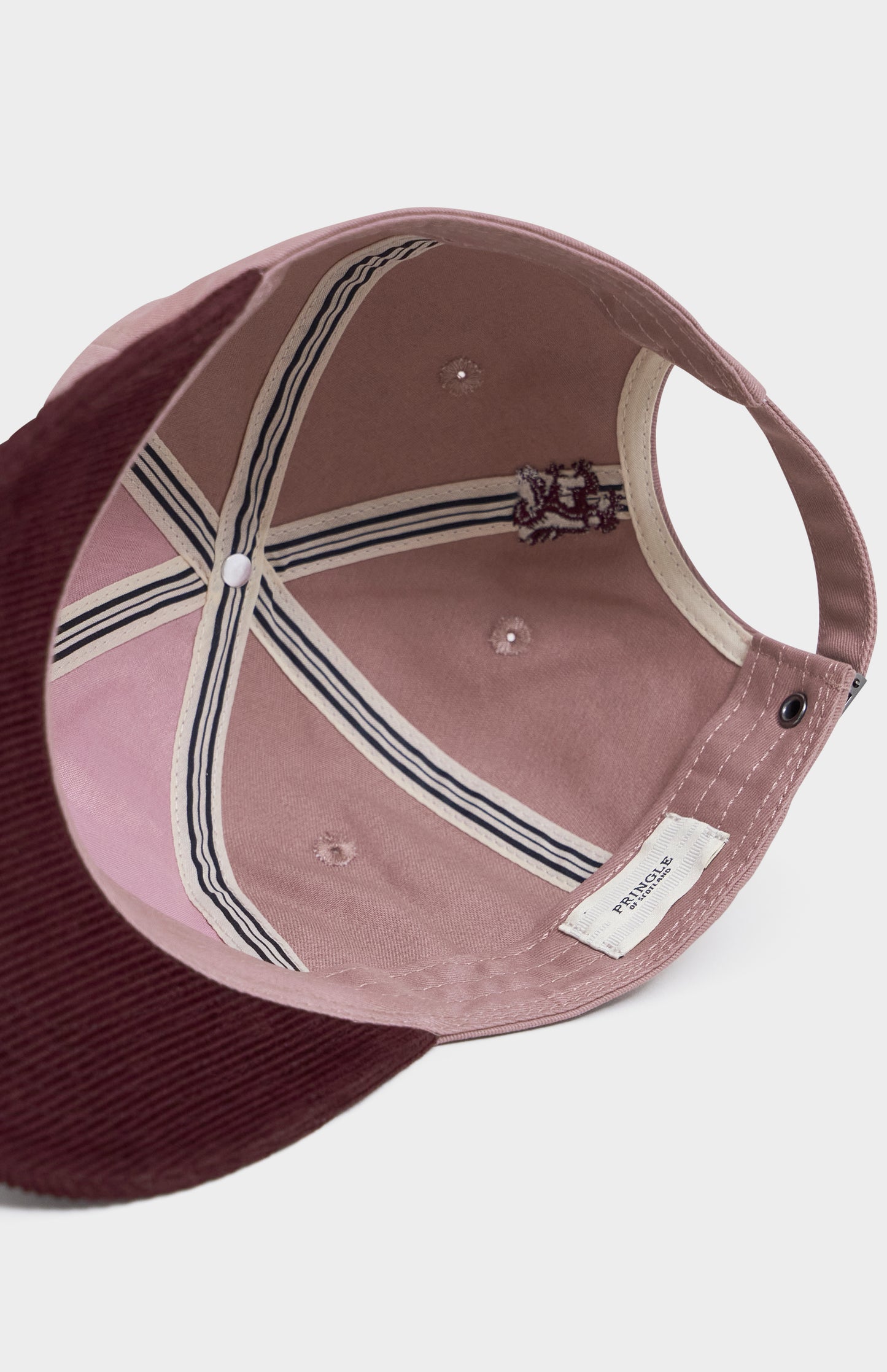Pink and burgundy baseball cap underside
