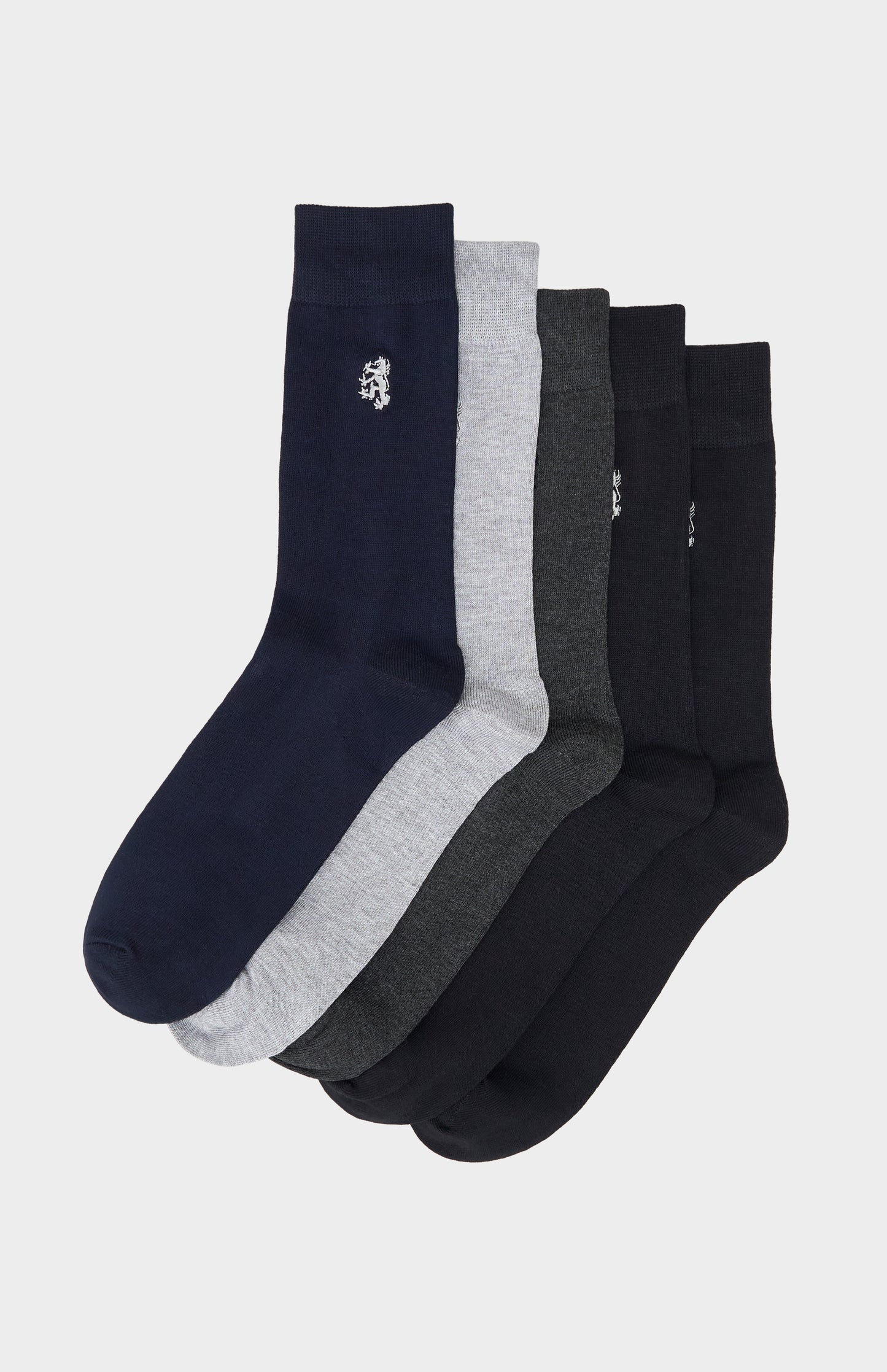 Set of five socks in navy, gray, and black with Pringle lion branding on a light gray background
