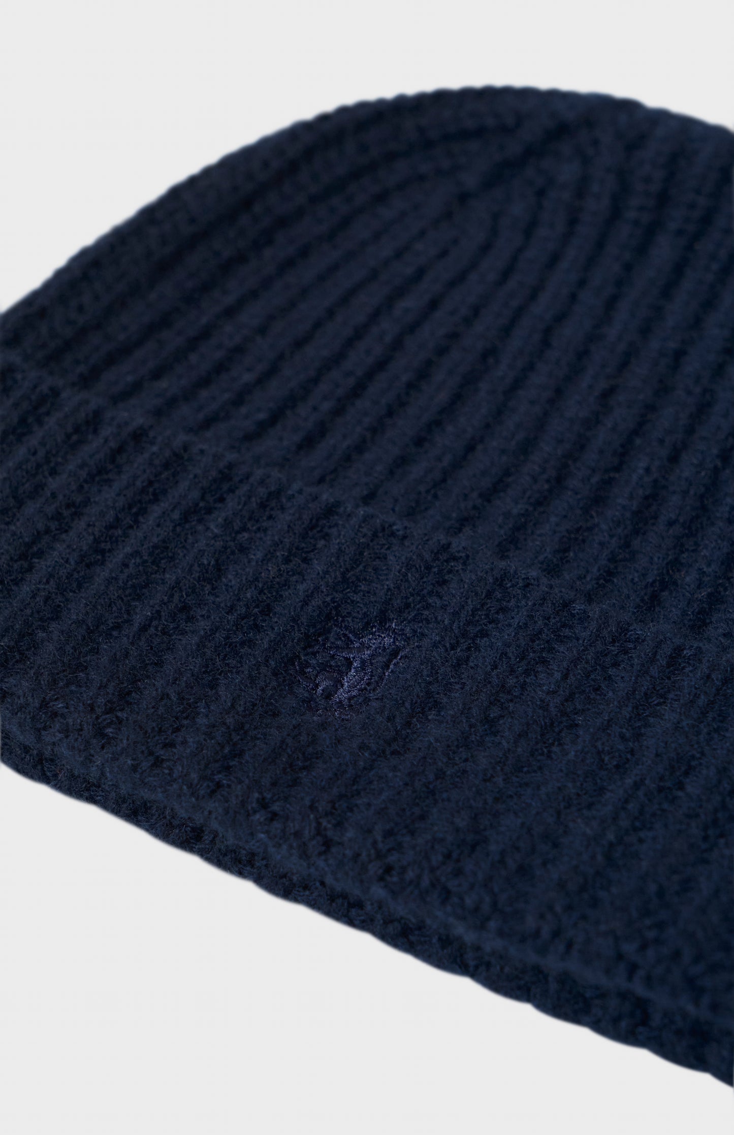Pringle of Scotland Ribbed Chunky Cashmere Beanie In Navy showing embroidery detail