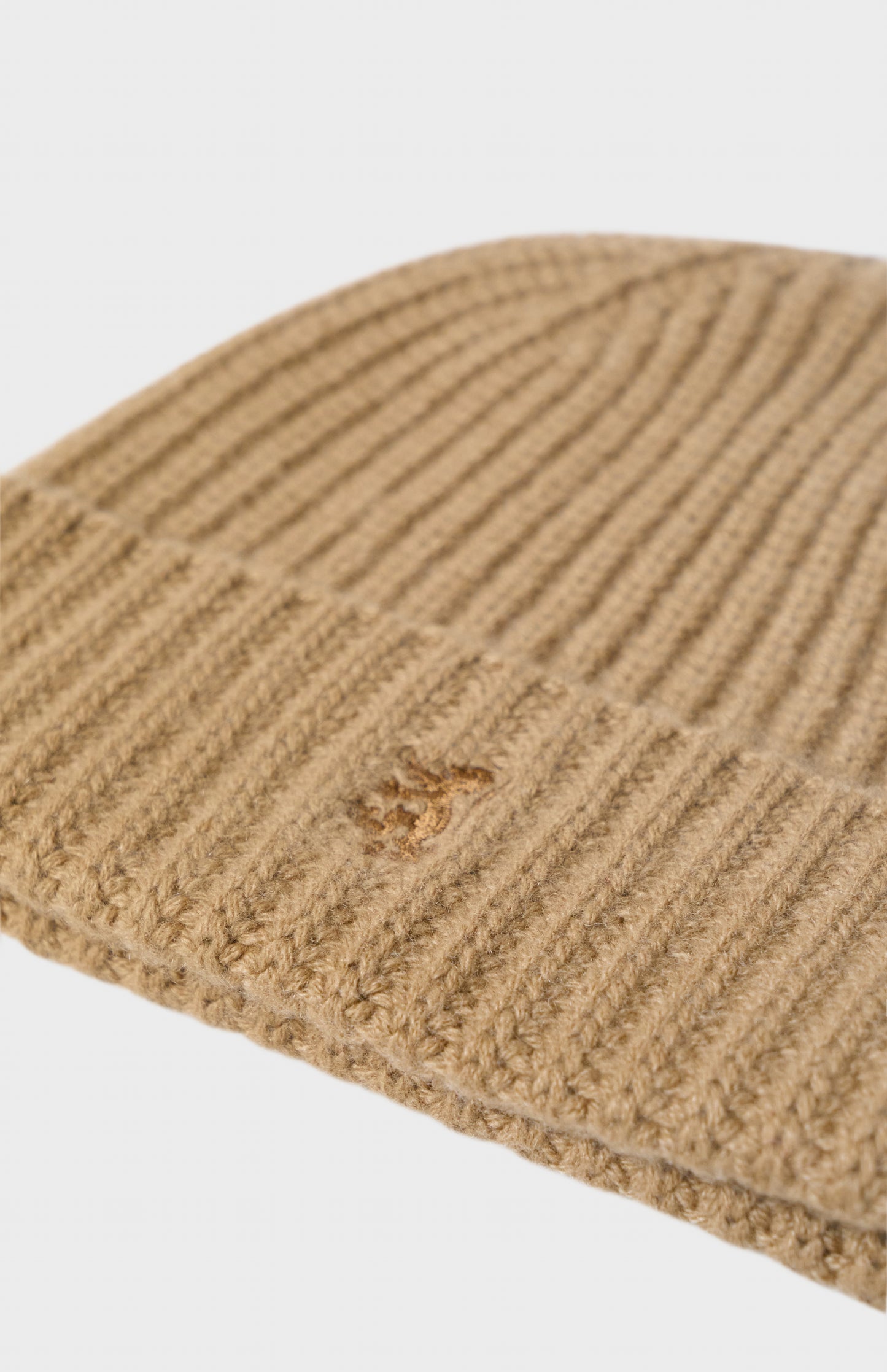 Pringle of Scotland Ribbed Chunky Cashmere Beanie In Camel showing embroidery detail