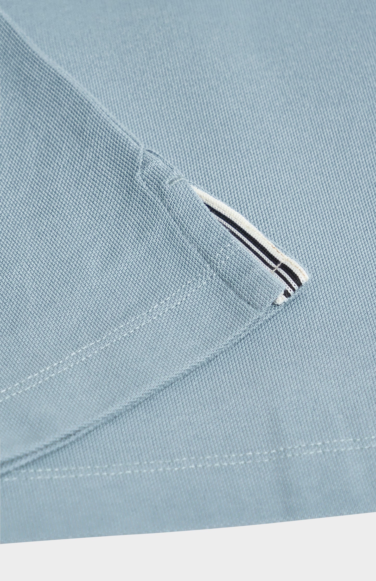 Close-up of a light blue fabric on a white background