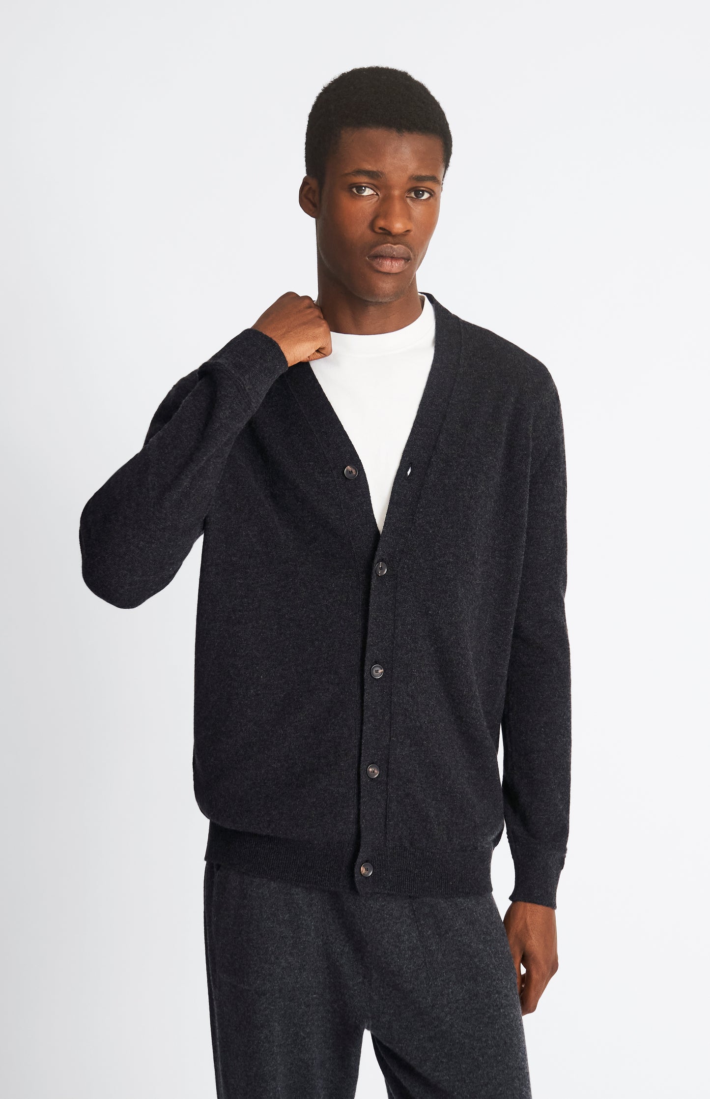 Pringle of Scotland Men's Classic Cashmere Cardigan in Charcoal.   Front Cropped Image on Model