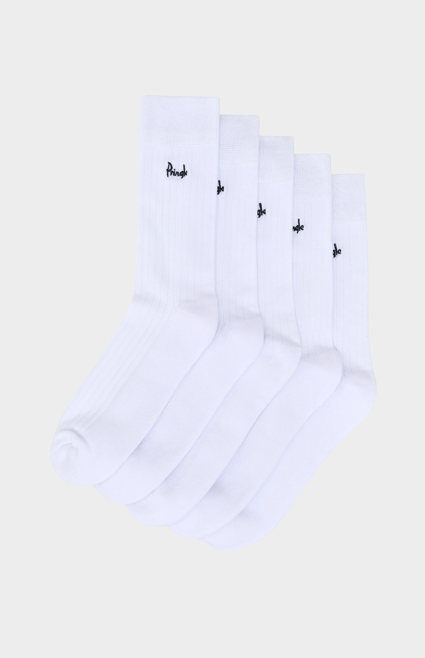 Set of white socks with Pringle branding on a light beige background