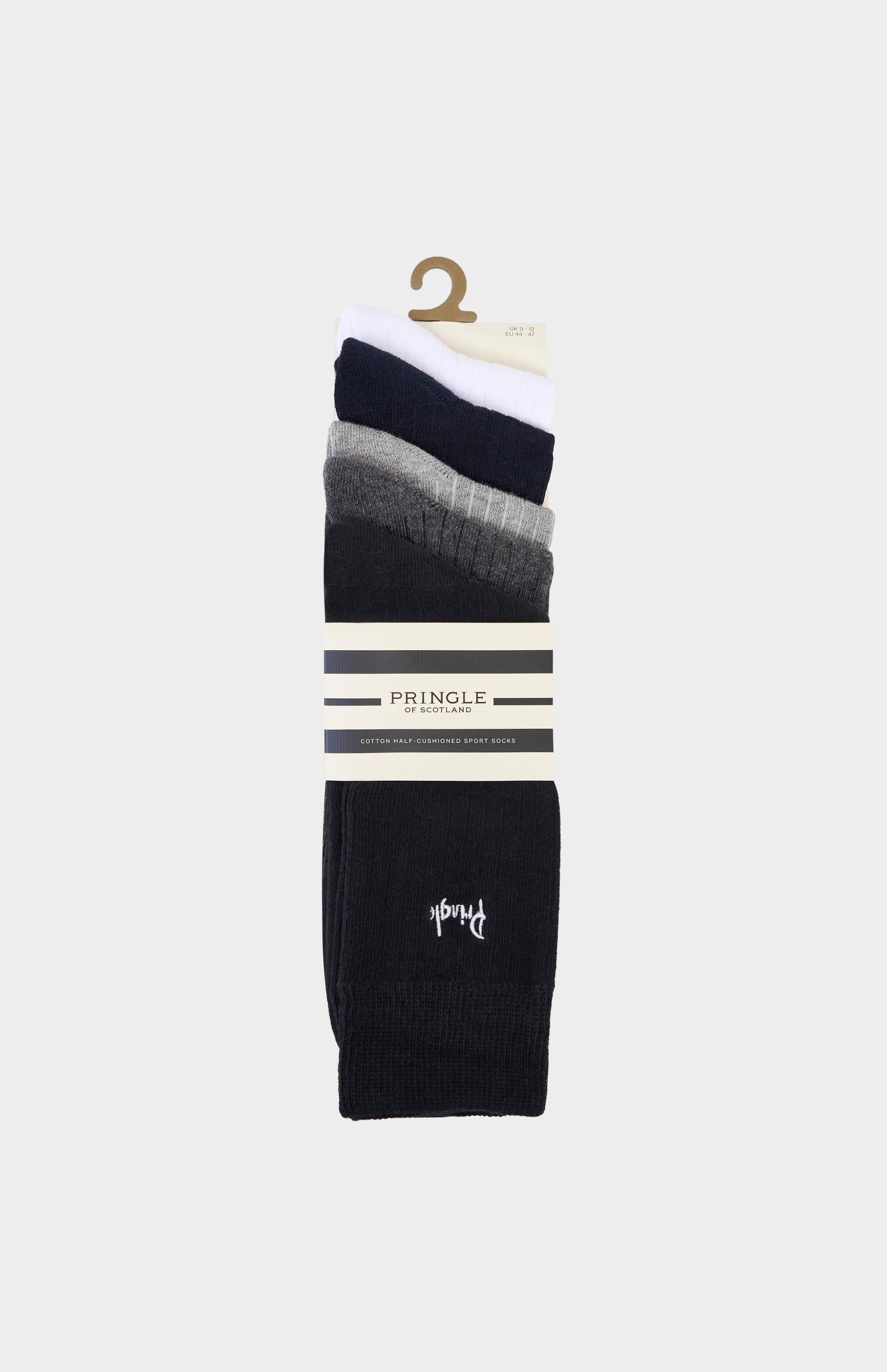 Set of different neutral coloured socks with Pringle branding on a white background
