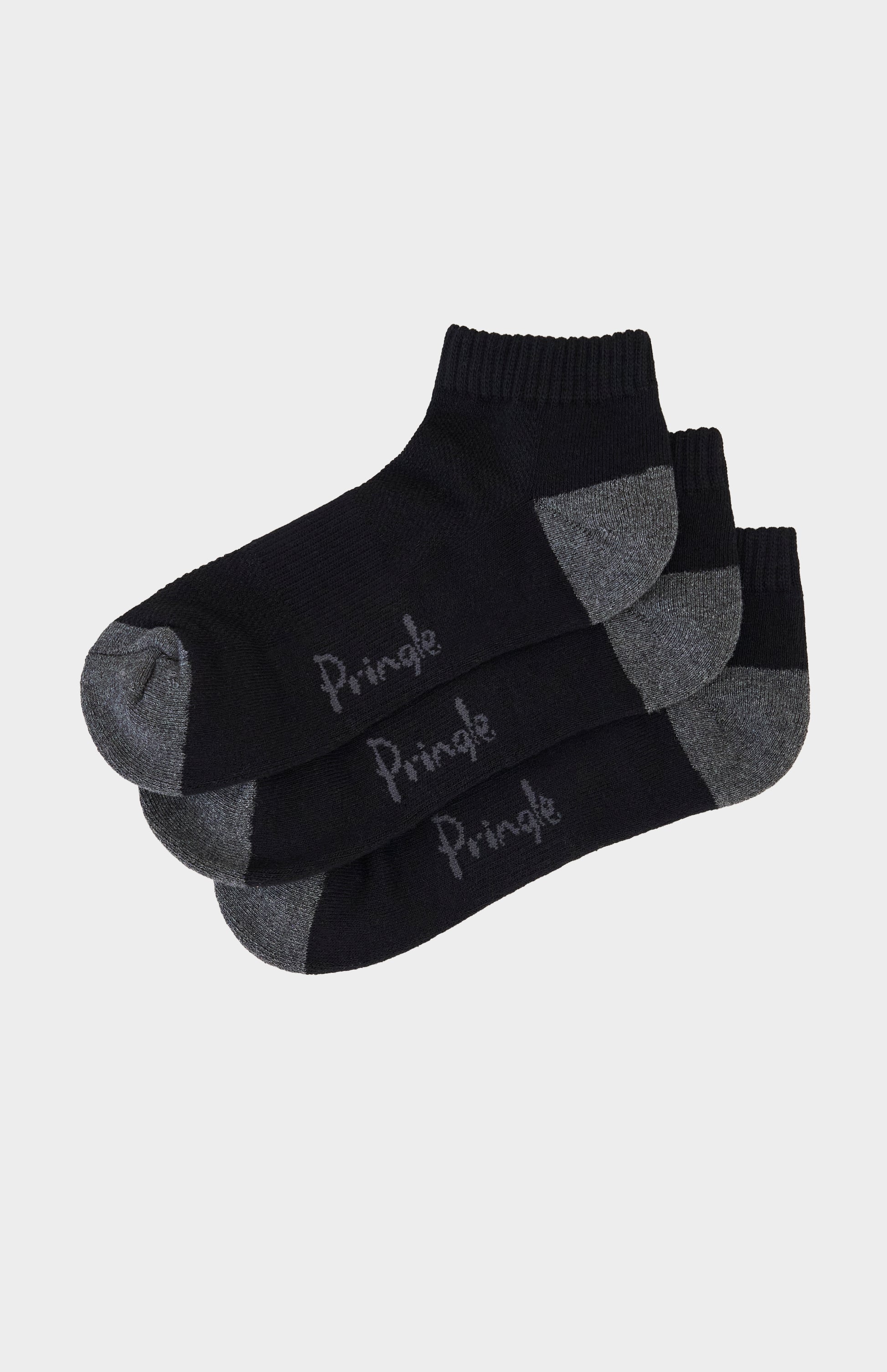 Three pairs of black socks with gray accents and 'Pringle' branding on a light gray background.