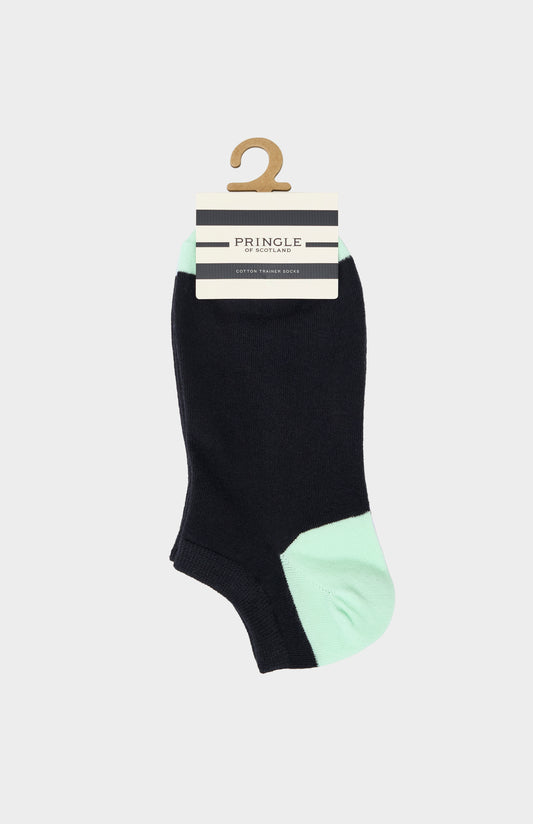 Black sock with green heel and toe on a Pringle hanger against a white background