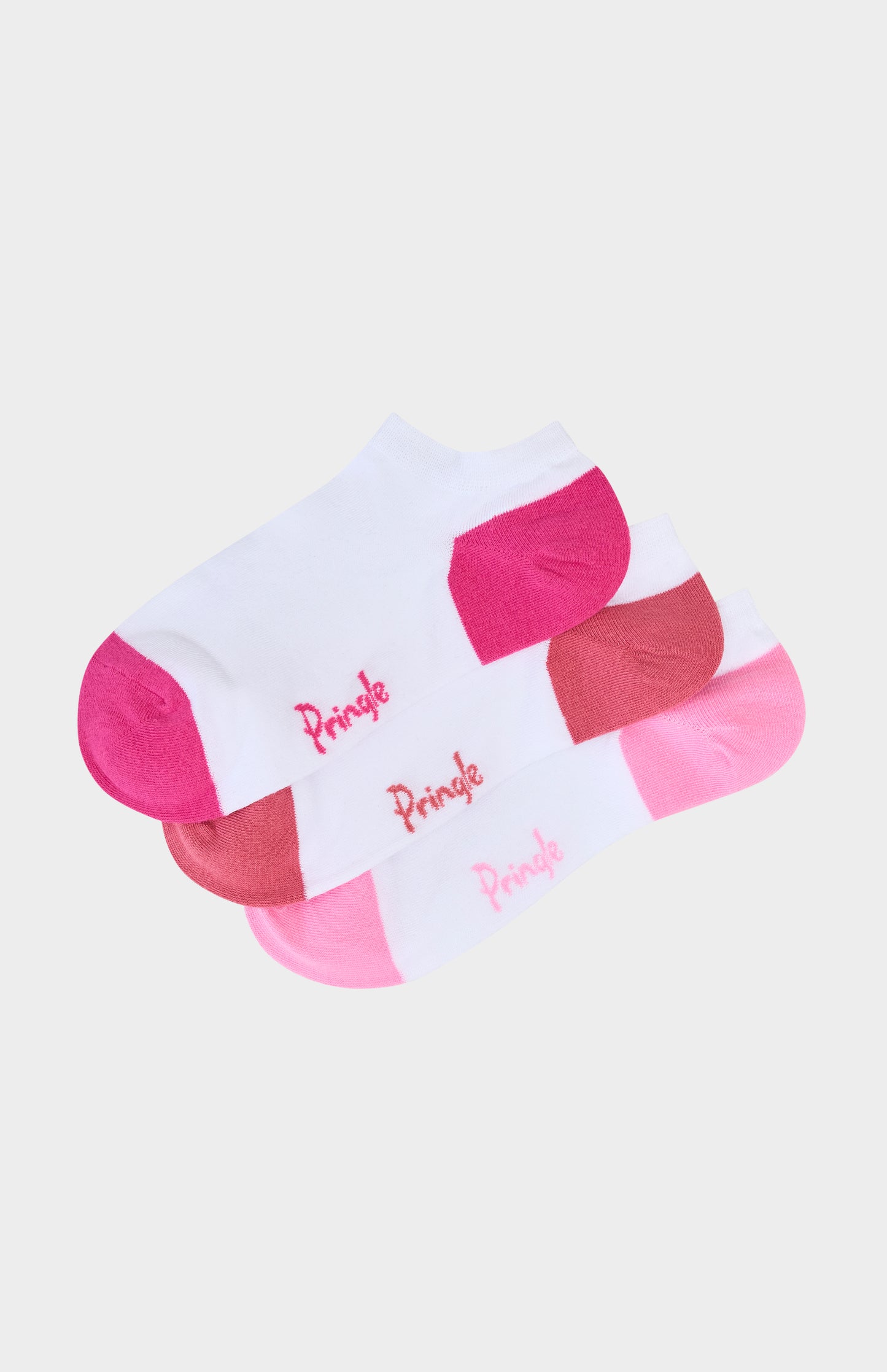 Set of pink and white socks with 'Pringle' branding on a light pink background