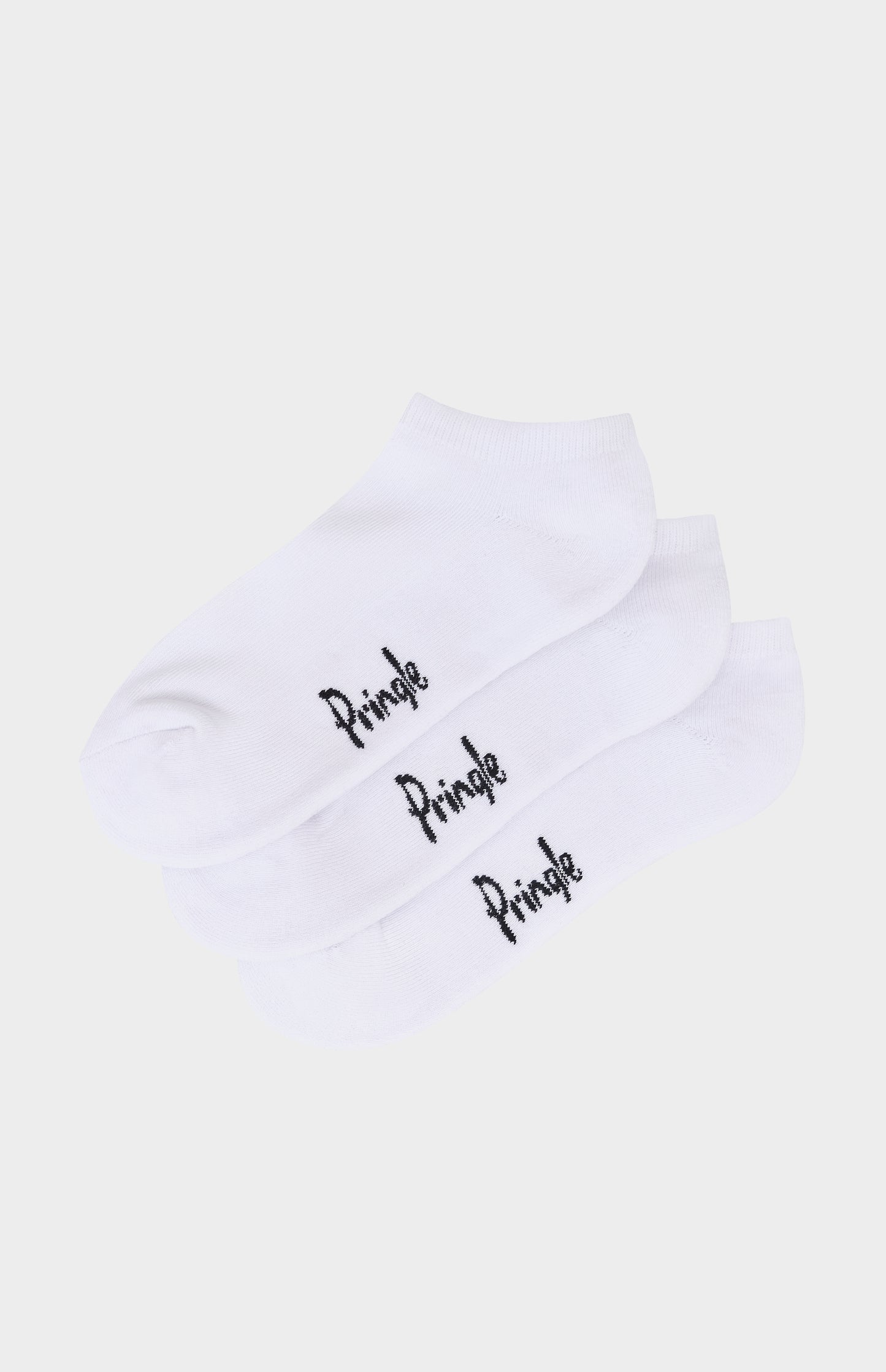 White socks with pringle branding against light grey background