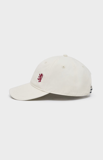 Ecru baseball cap with red lion embroidery on the right hand side