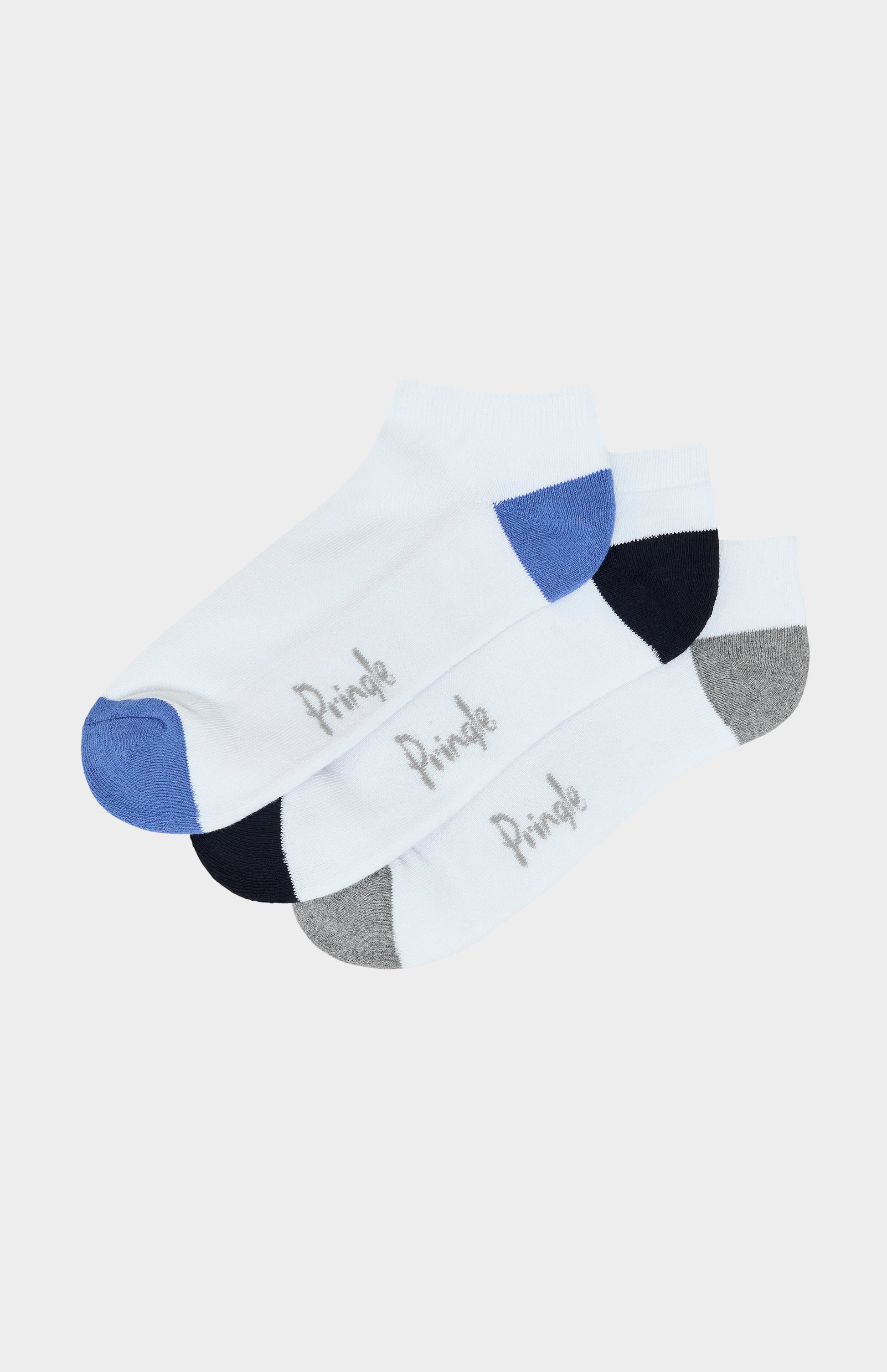 Three socks with geometric patterns on a white background
