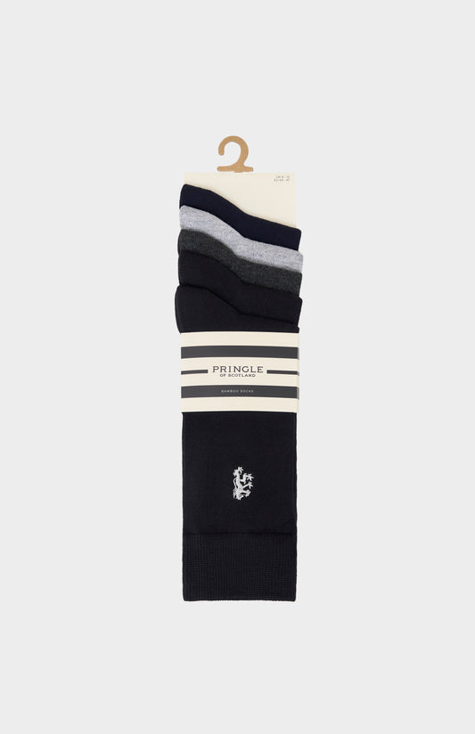 Stack of black and gray socks on a hanger with Pringle lion branding