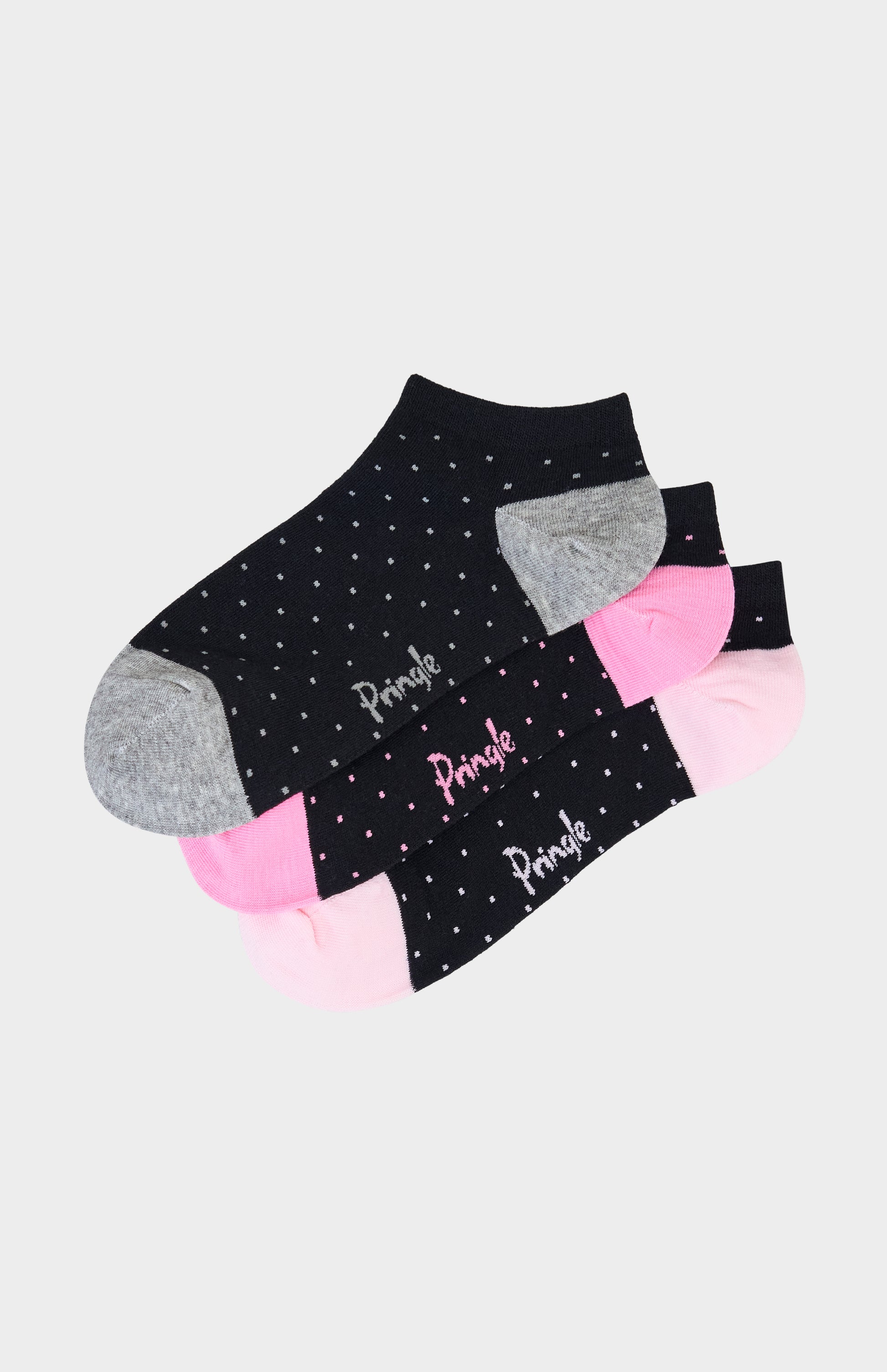 Set of black ankle socks with pink and gray polka dots on a light gray background