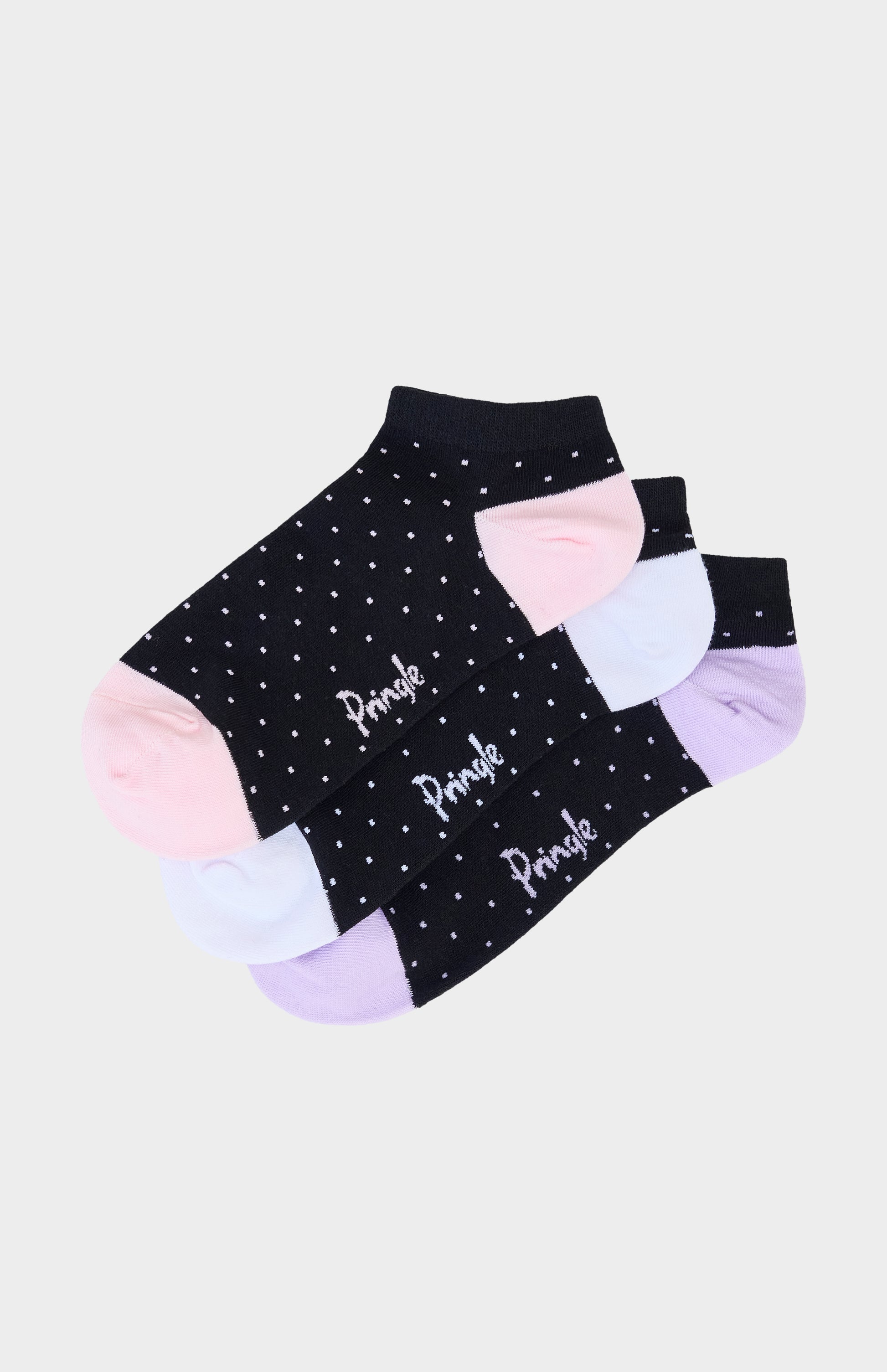 Black ankle socks with pink, light blue, and light purple polka dots and text on a light gray background
