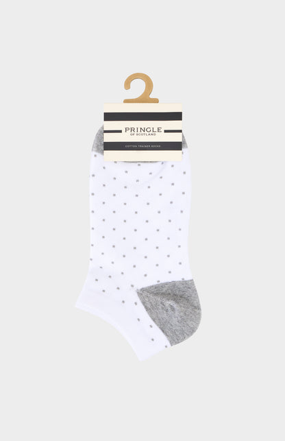 White socks with grey polka dots and gray toes and heels on a hanger against a white background, featuring the brand 'Pringle'.