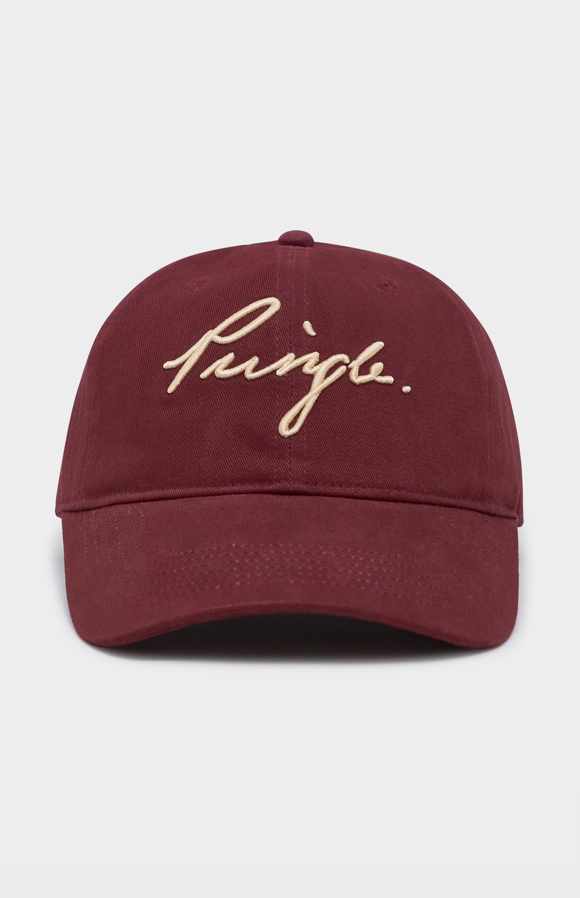Maroon cap with gold embroidered text on a light gray background
