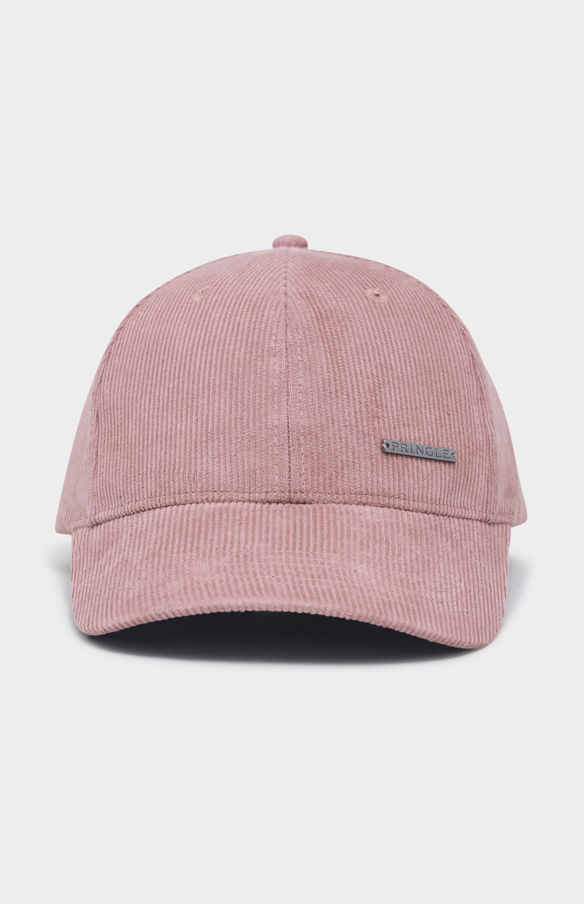 Dusty pink corduroy baseball cap with metal badging on the front