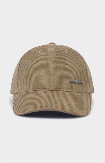 Beige cap with a small logo on a light gray background