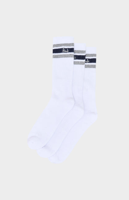 White socks with black and gray striped accents on a beige background
