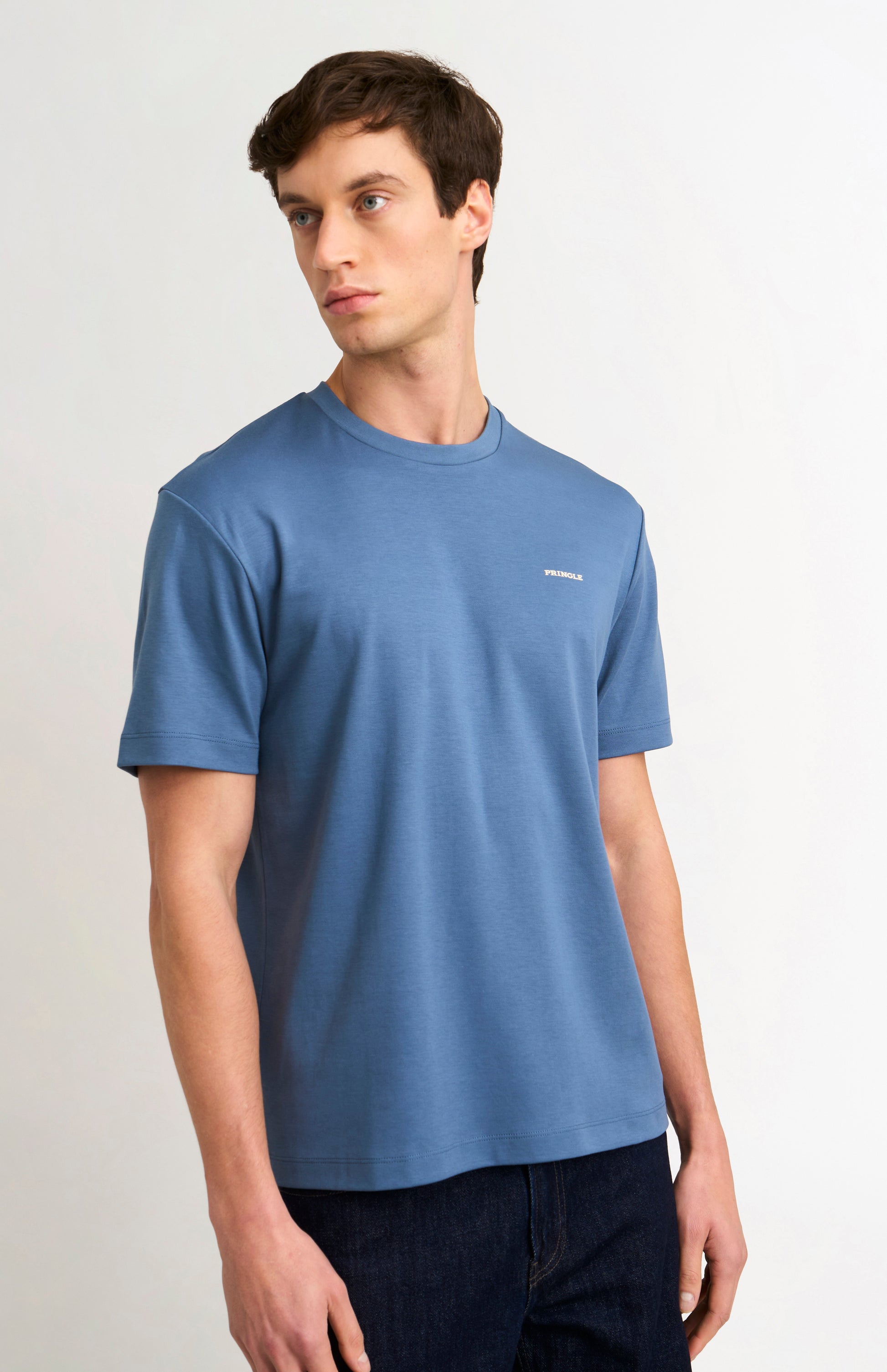 Man wearing a blue t-shirt on a white background