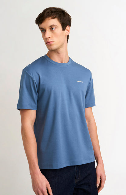 Man wearing a blue t-shirt on a white background