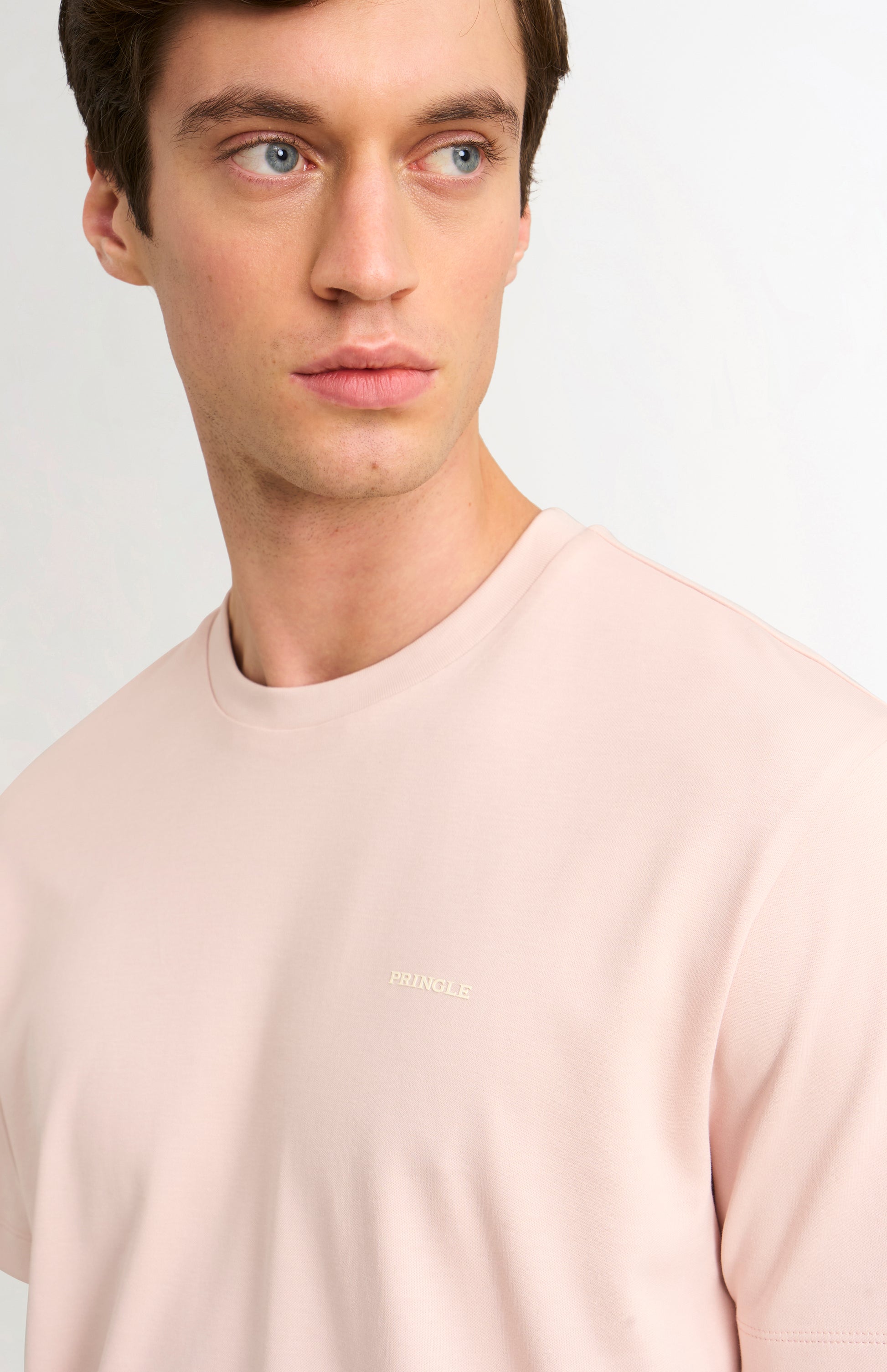 Light pink t-shirt on a white background