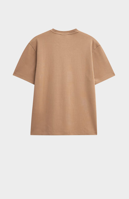 Beige t-shirt on a light gray background