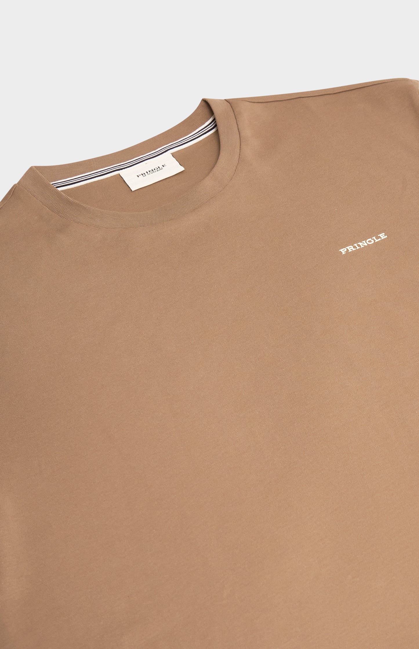 Brown t-shirt with a small logo on a white background