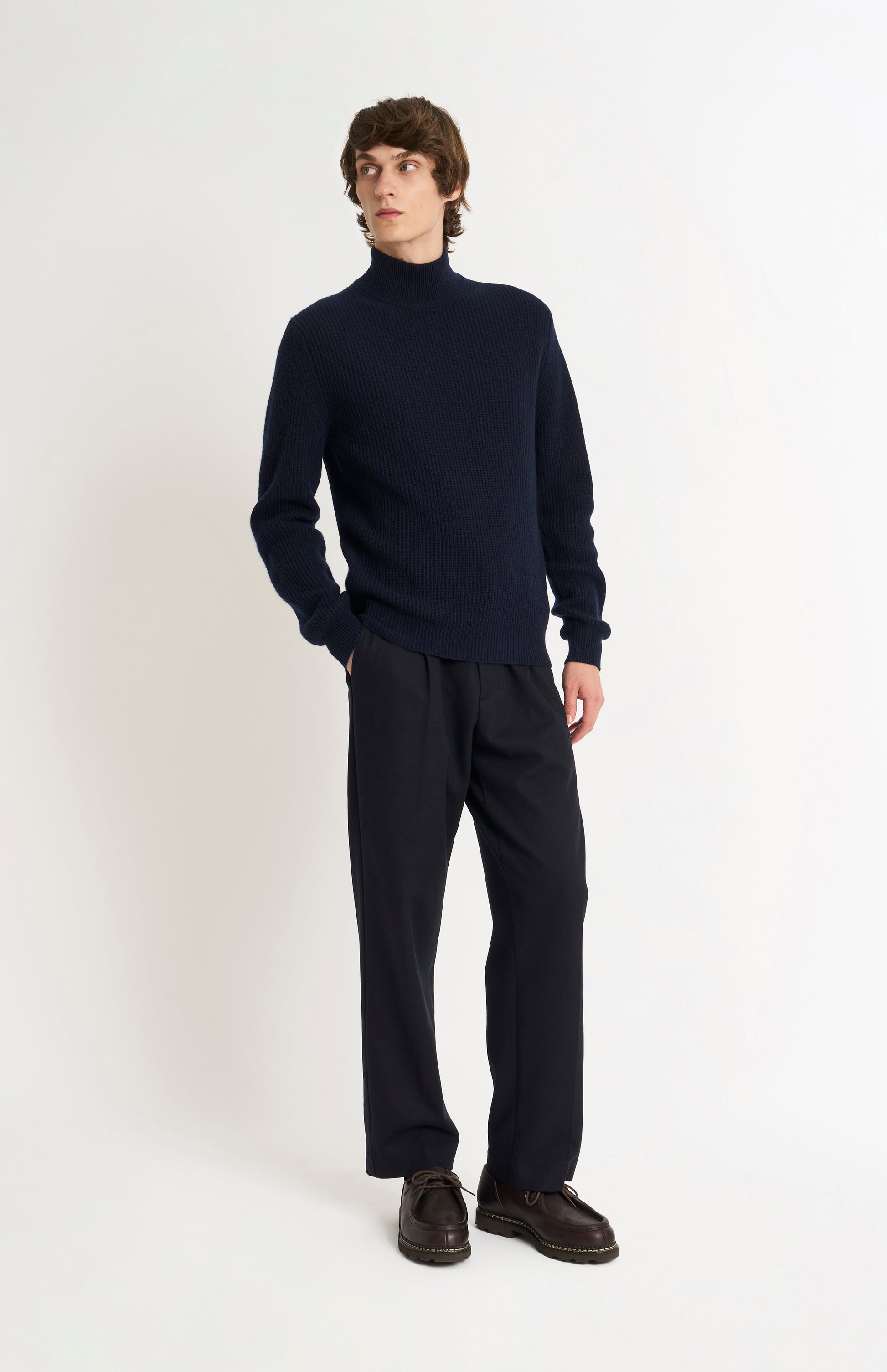 Pringle of Scotland Men’s Cashmere Mock Neck Jumper In Navy Blue on standing model