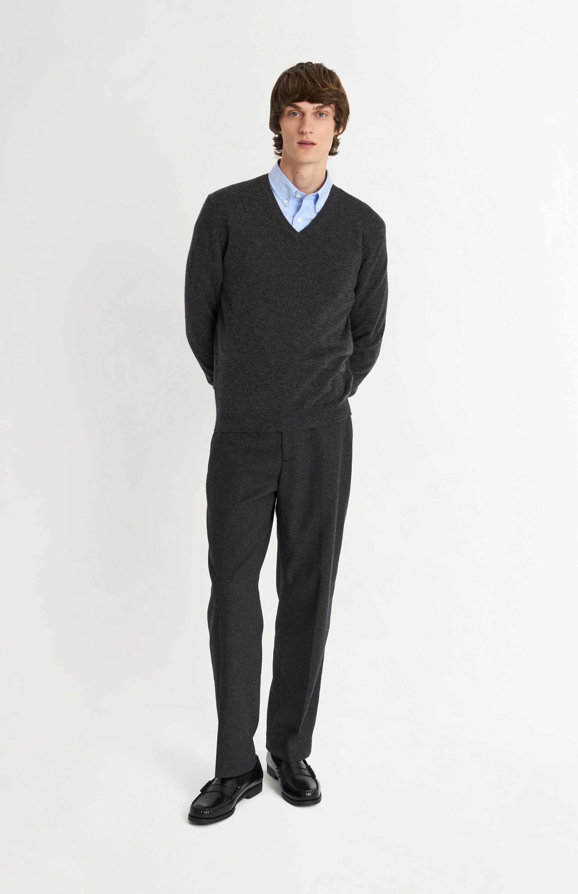 Pringle of Scotland Men’s Cashmere V-Neck Jumper In Charcoal Melange on standing model
