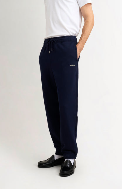 Pringle of Scotland Men's Track Pants In Navy Blue on model side view