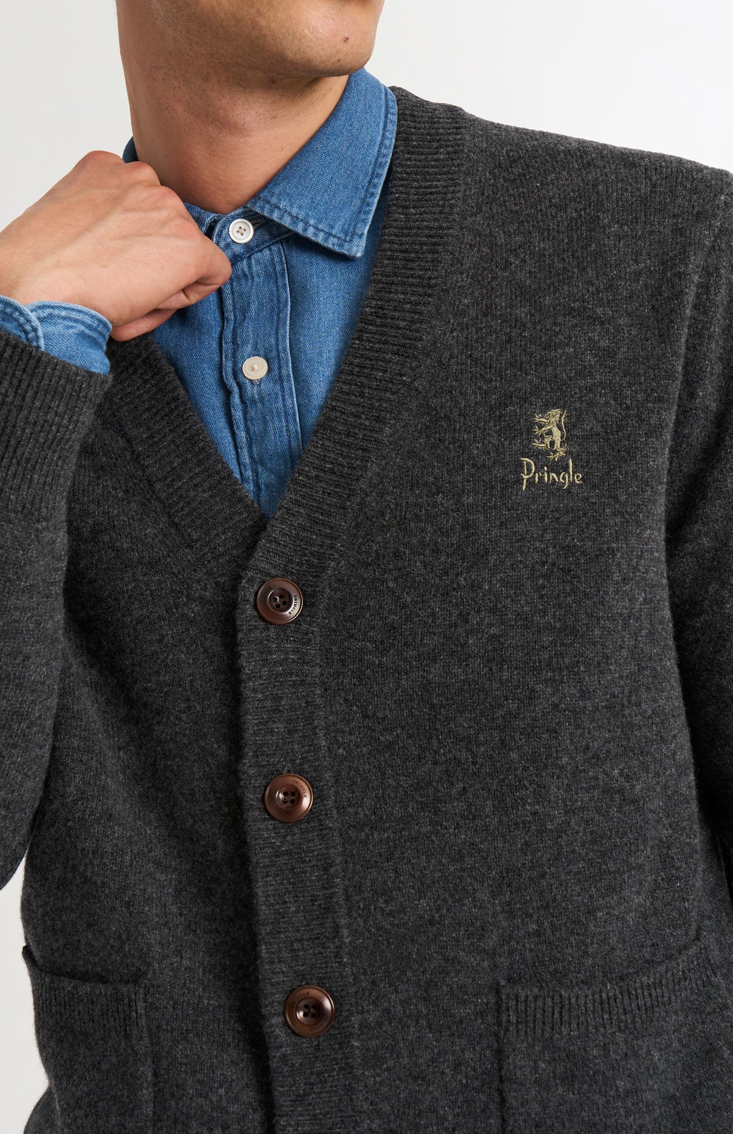 Pringle of Scotland Men’s Lambswool Cardigan In Charcoal showing button detail