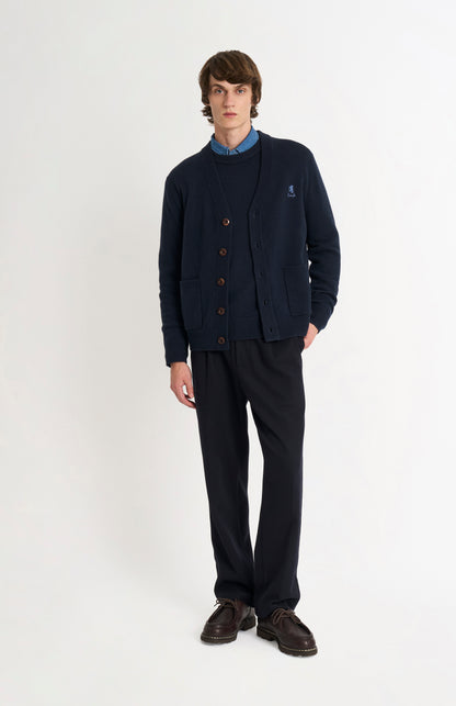 Pringle of Scotland Men’s Lambswool Cardigan In Navy Blue on standing model