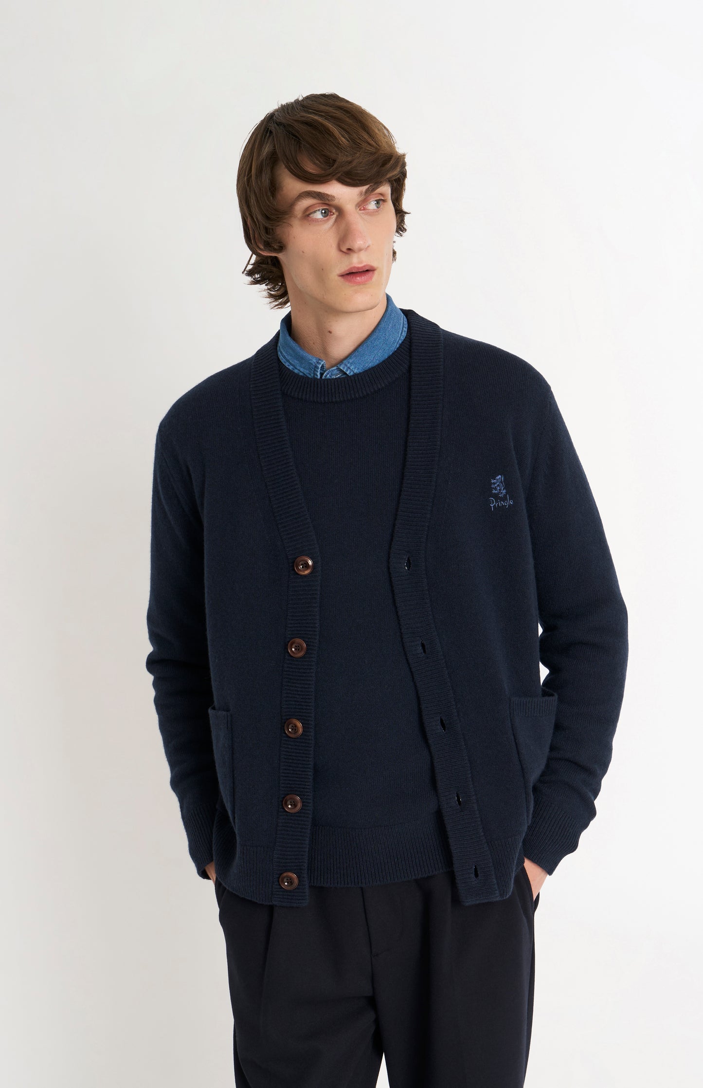Pringle of Scotland Men’s Lambswool Cardigan In Navy Blue on model