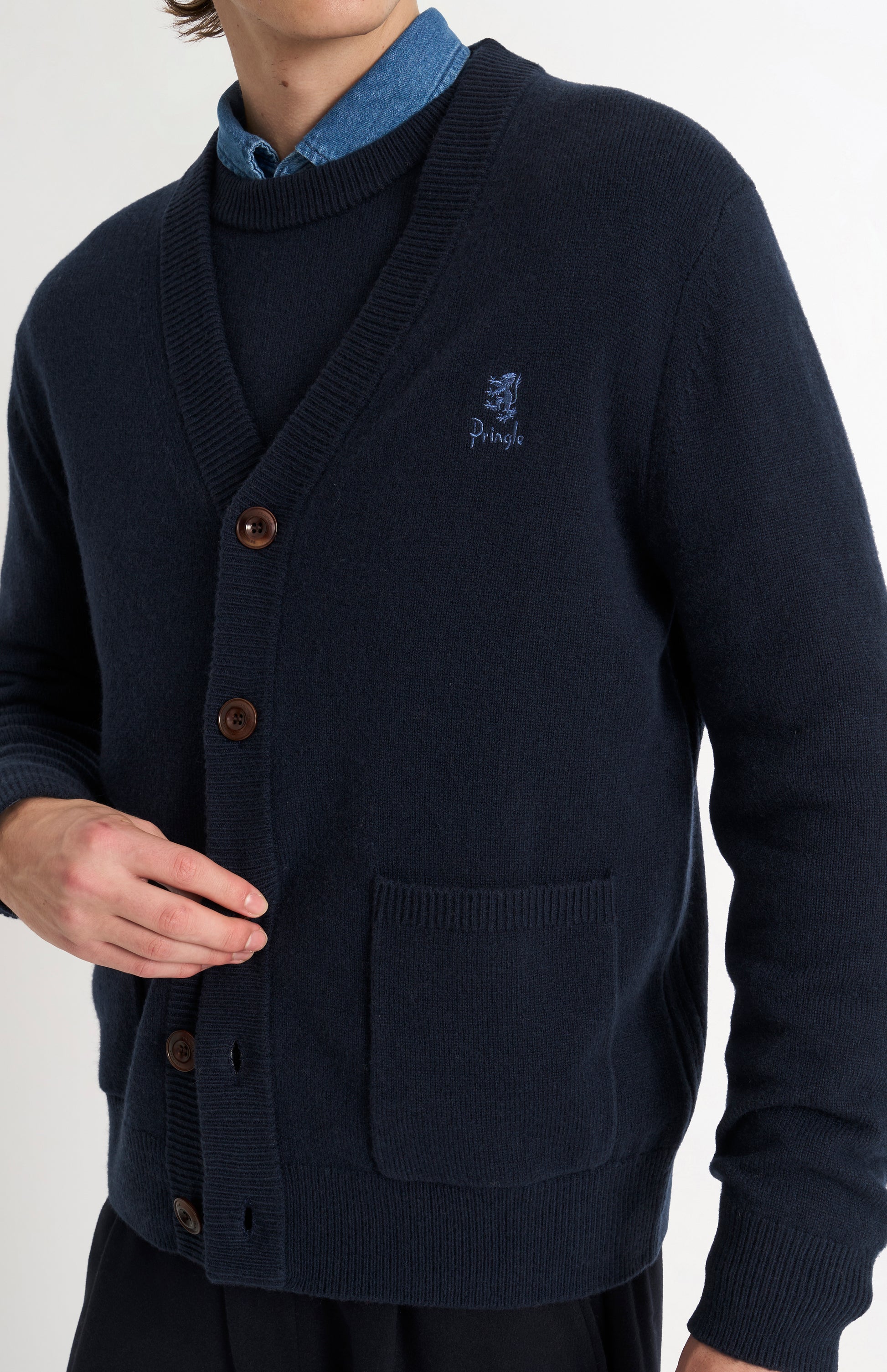 Pringle of Scotland Men’s Lambswool Cardigan In Navy Blue showing button detail