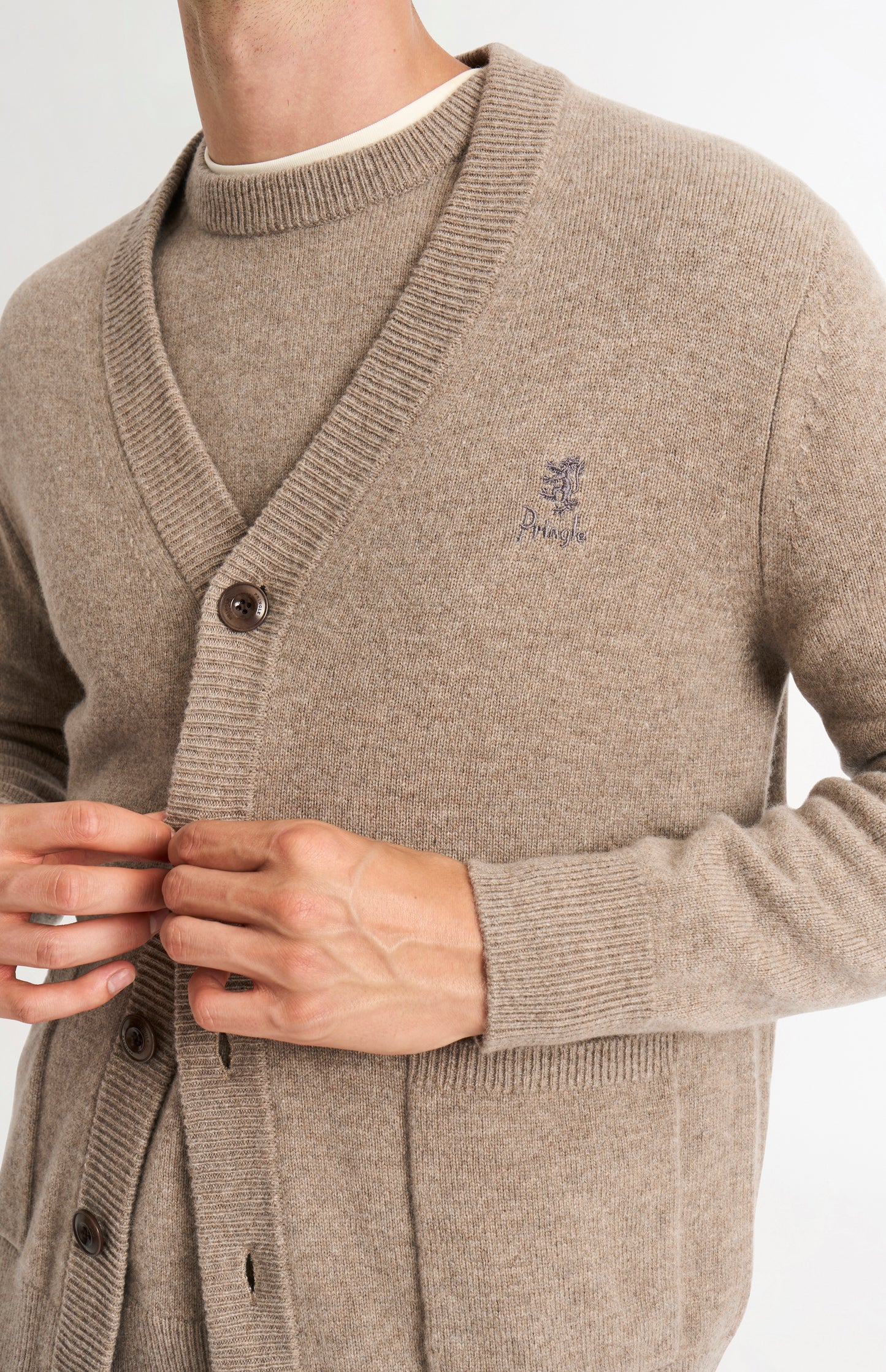Pringle of Scotland Men’s Lambswool Cardigan In Mushroom showing button detail
