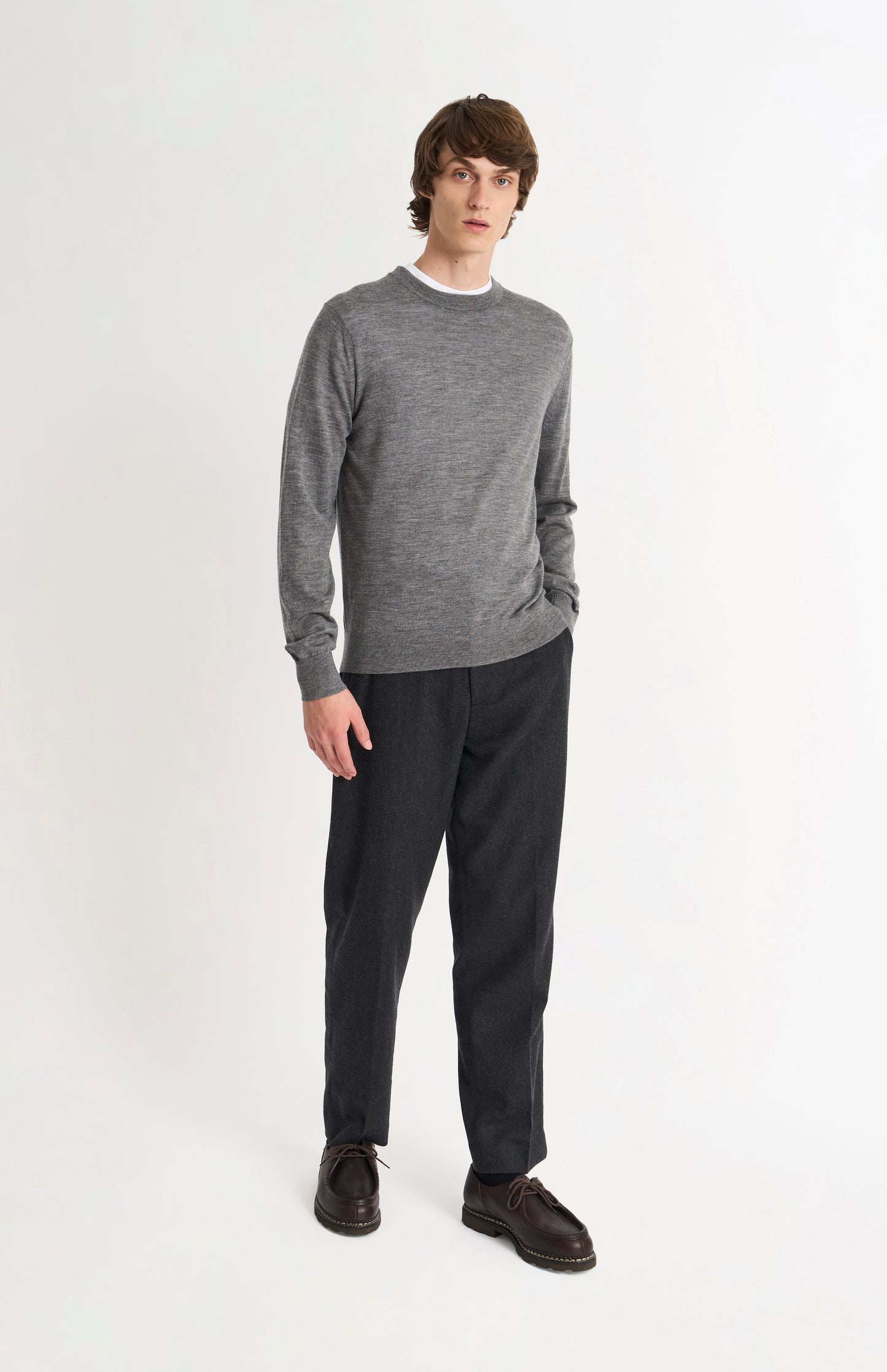 Pringle of Scotland Men’s Merino Wool Crew Neck Jumper In Grey Melange on standing model