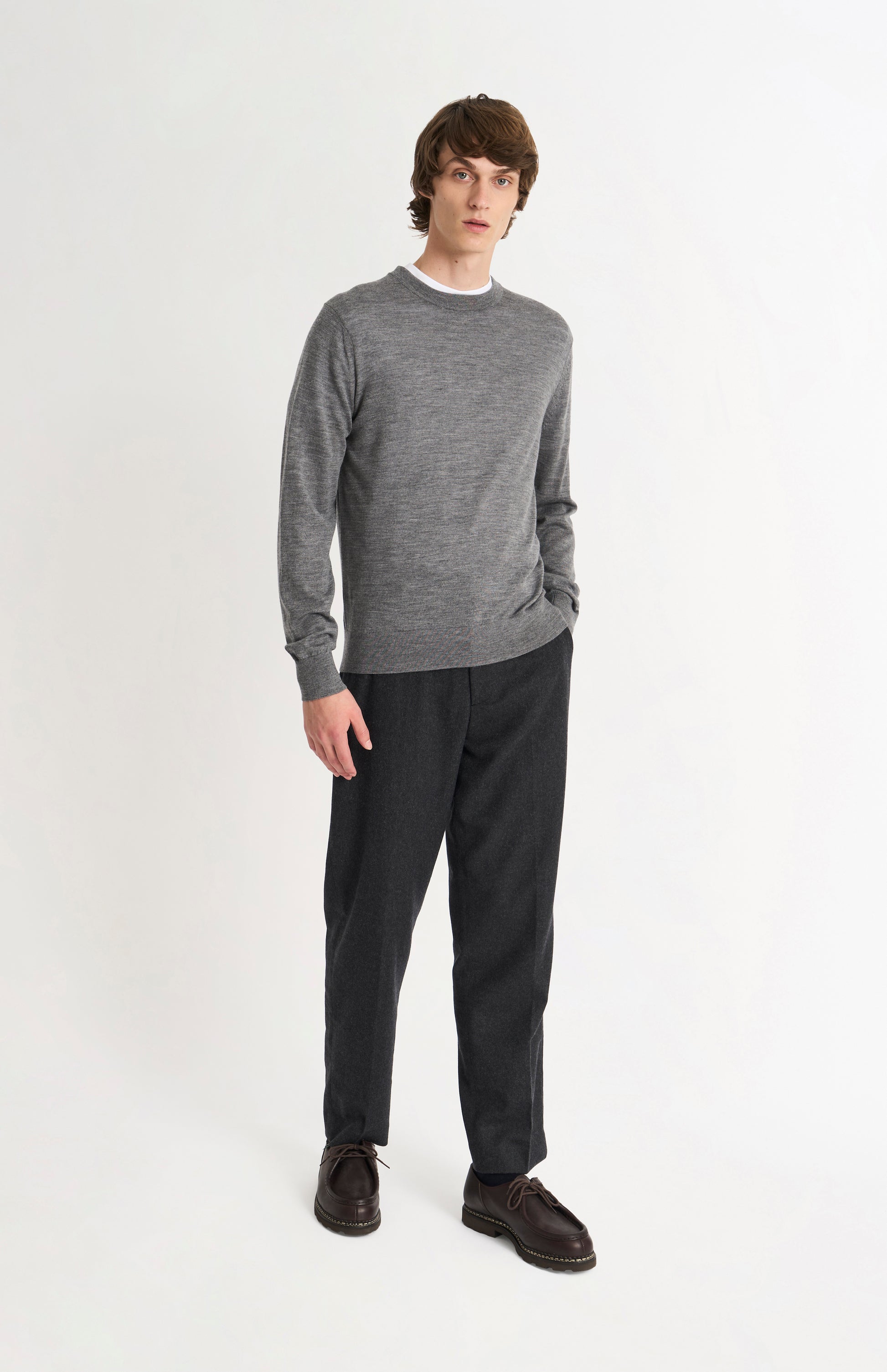 Pringle of Scotland Men’s Merino Wool Crew Neck Jumper In Grey Melange on standing model