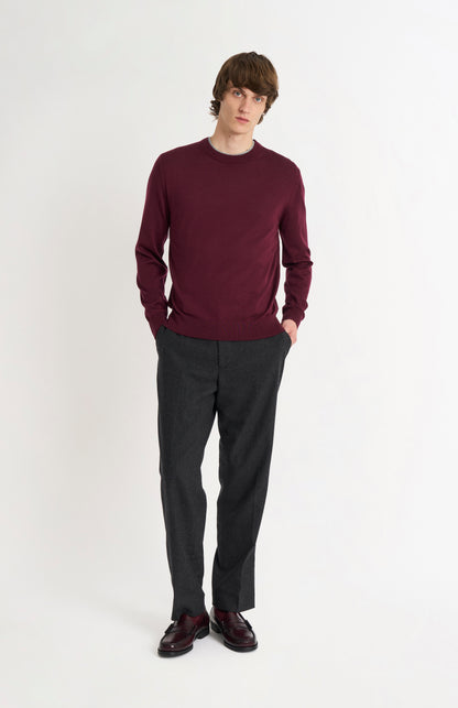 Pringle of Scotland Men’s Merino Wool Crew Neck Jumper In Burgundy on standing model