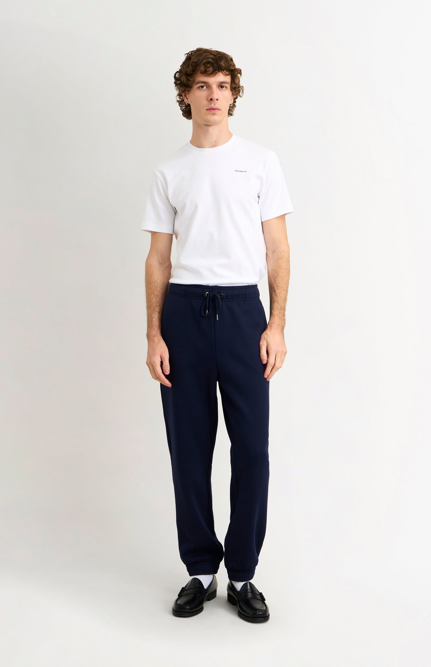 Pringle Men's Track Pants In Navy Blue on model full length