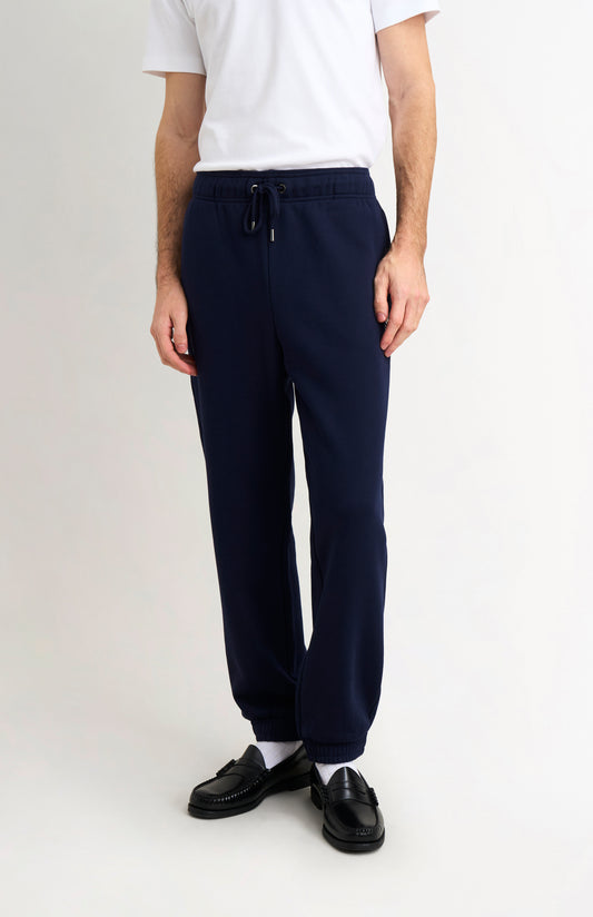 Pringle Men's Track Pants In Navy Blue on model