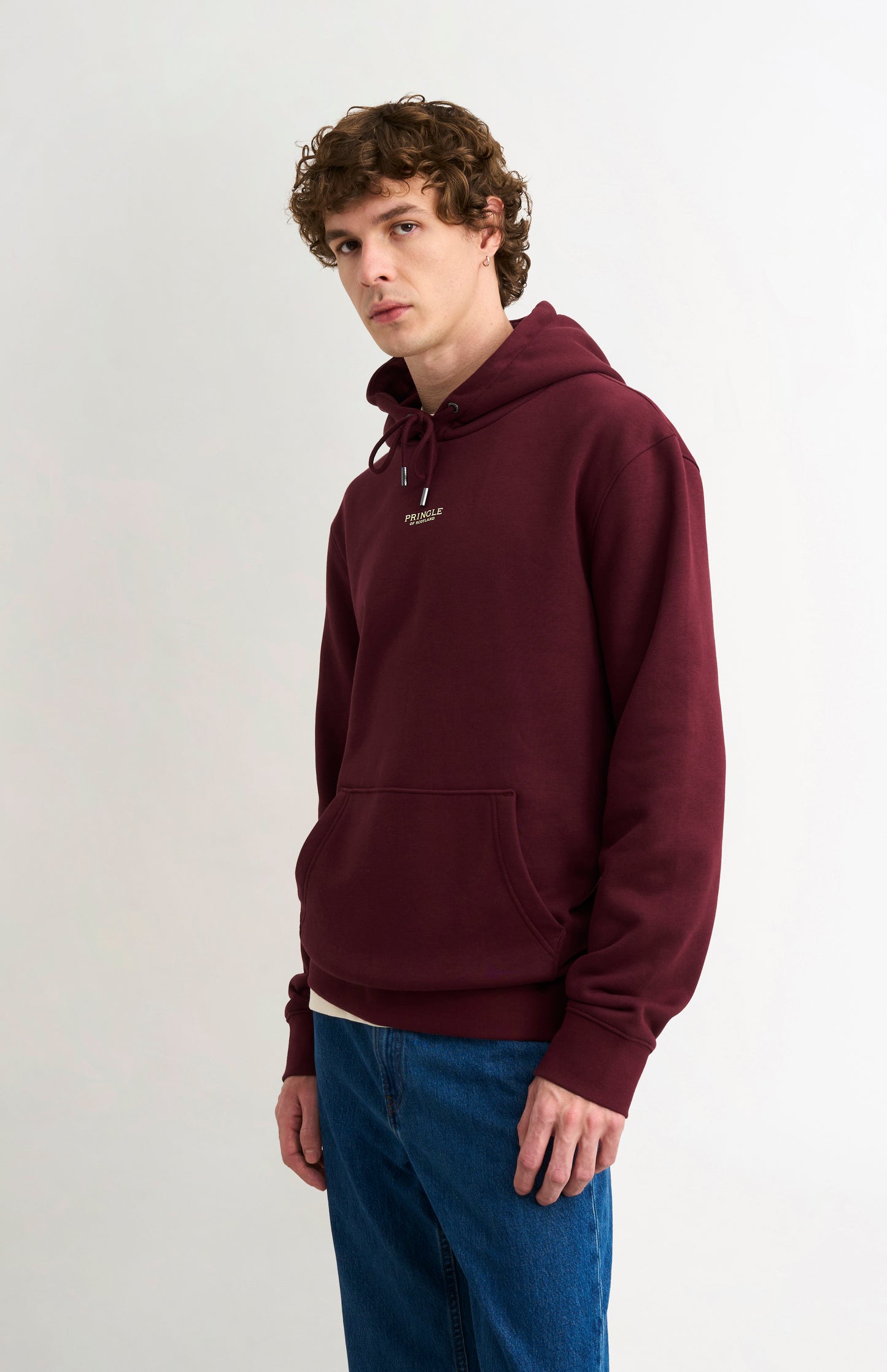 Pringle Men's Hooded Jumper In Burgundy on model side view