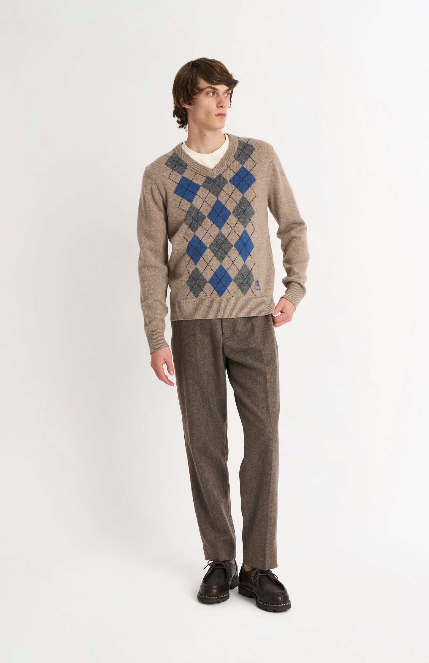 Pringle Men’s Lambswool Argyle V-Neck Jumper in  Mushroom, Blue & Grey on model full length