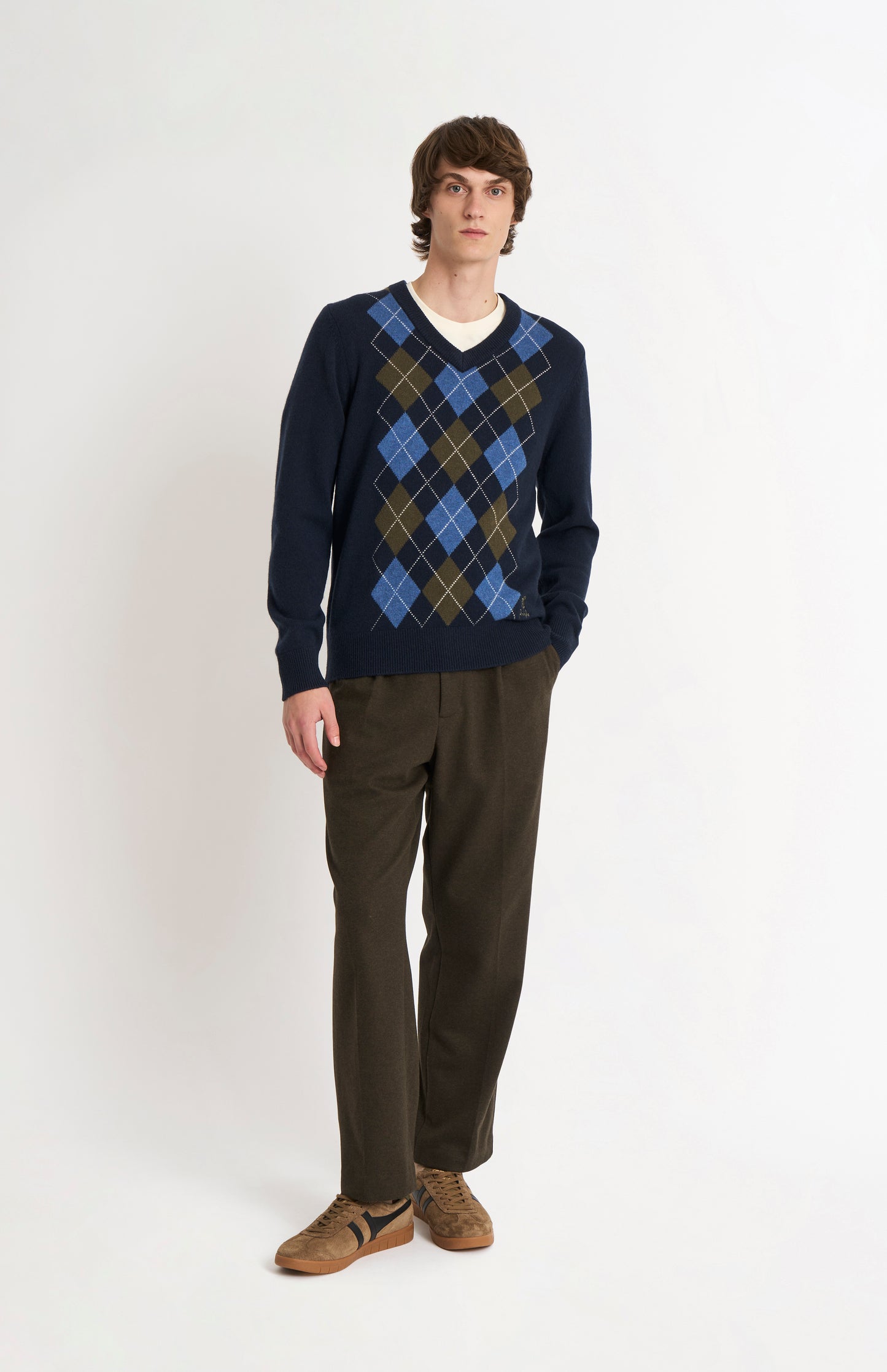 Pringle Men’s Lambswool Argyle V-Neck Jumper in Navy, Olive & Blue on model full length