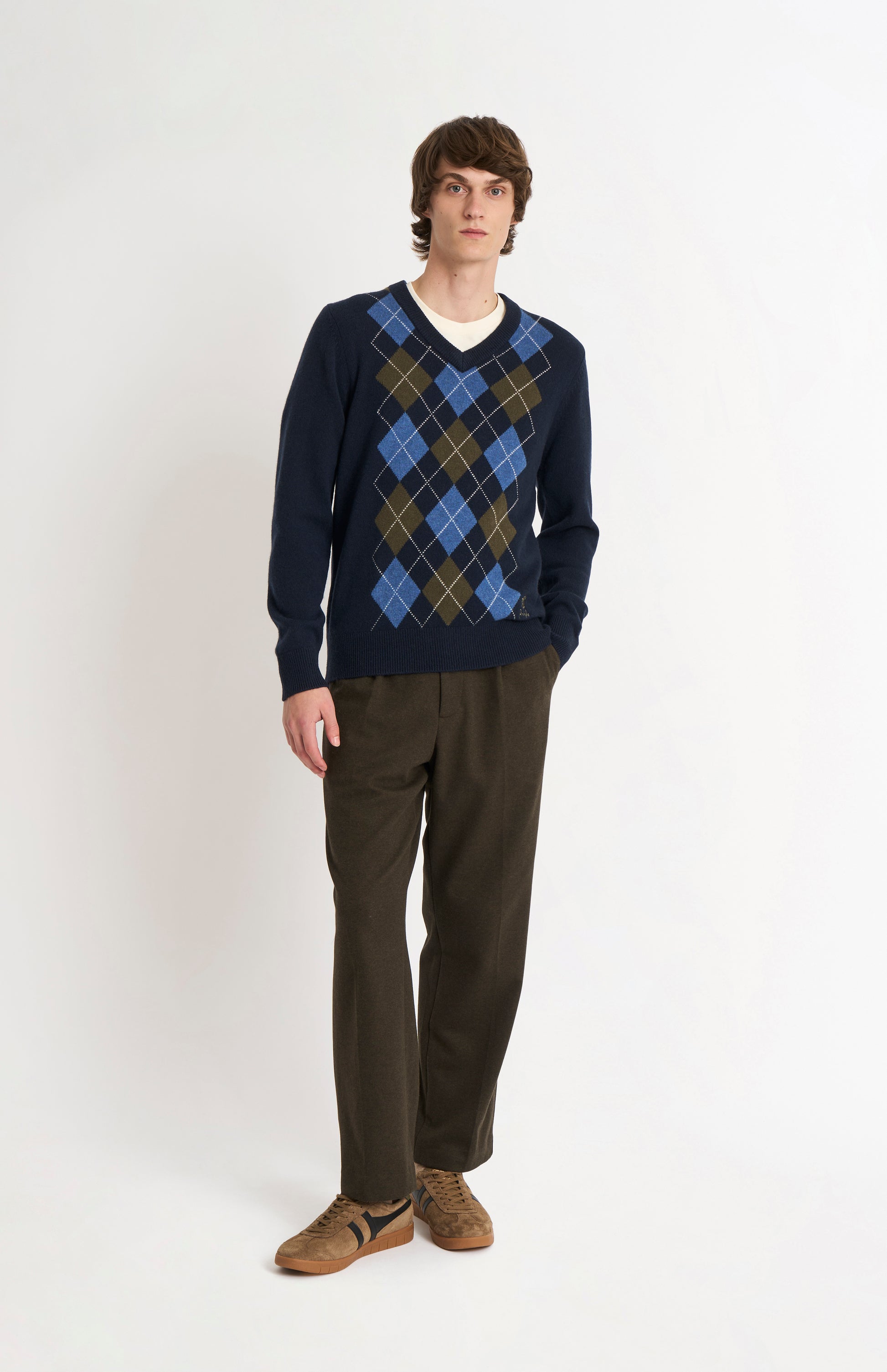 Pringle Men’s Lambswool Argyle V-Neck Jumper in Navy, Olive & Blue on model full length