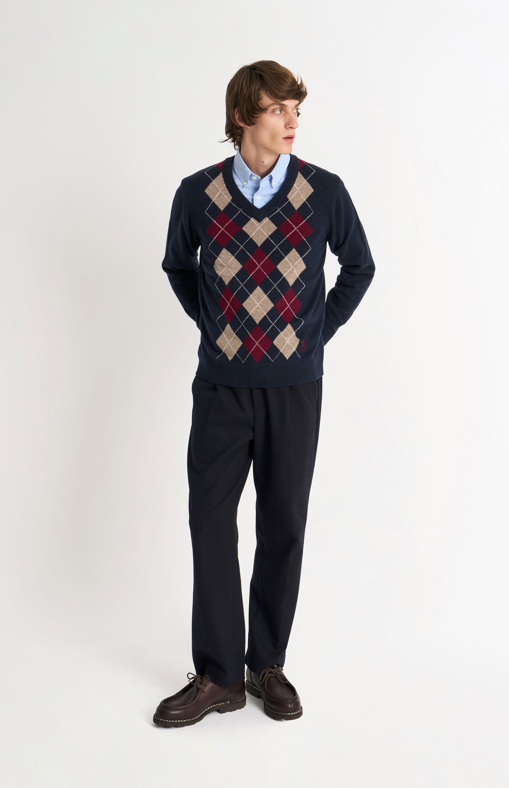 Pringle Men’s Lambswool Argyle V-Neck Jumper in Navy, Mushroom & Burgundy on model fulllength