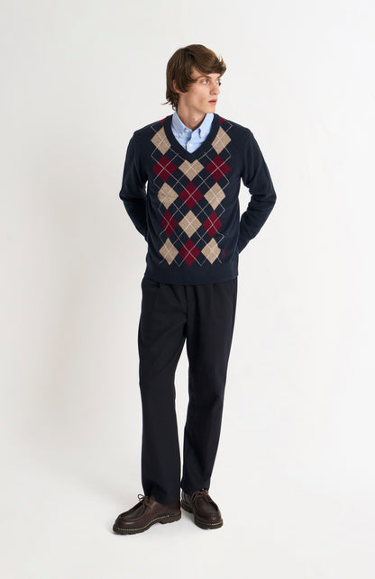 Pringle Men’s Lambswool Argyle V-Neck Jumper in Navy, Mushroom & Burgundy on model fulllength
