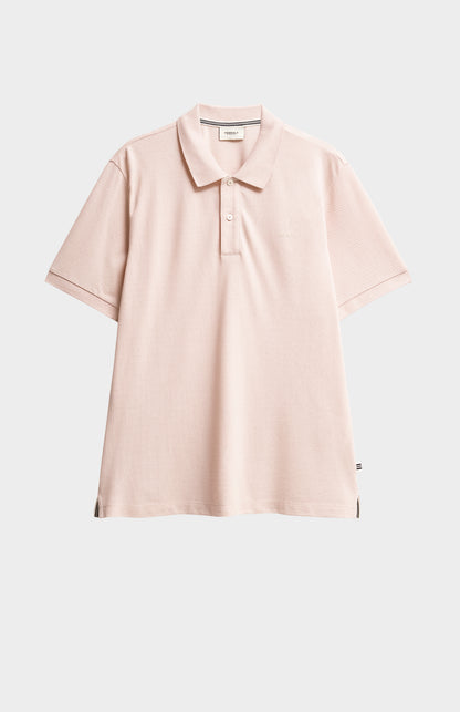 Dusty pink polo shirt on a white background