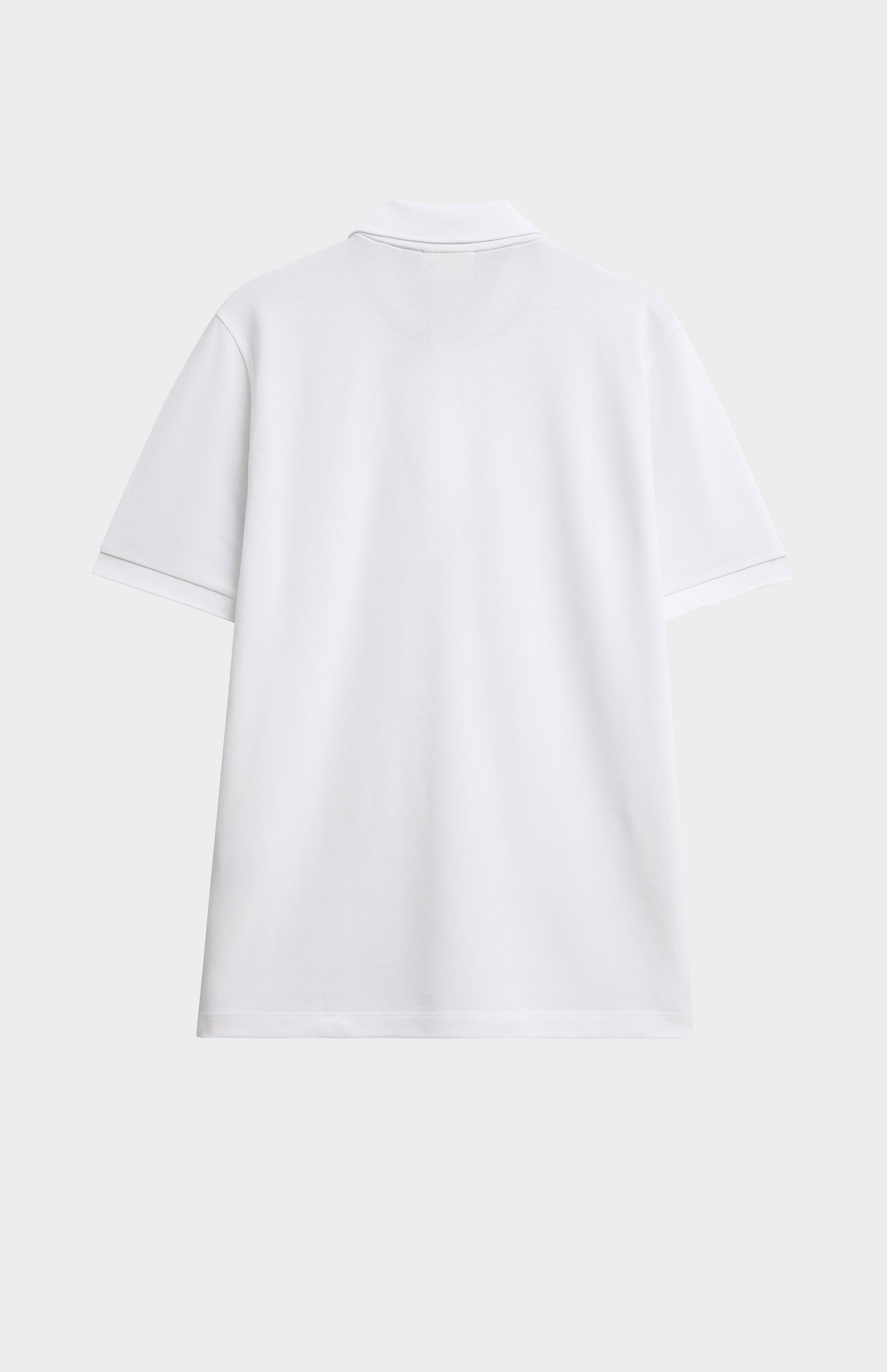 White polo shirt on a light gray background