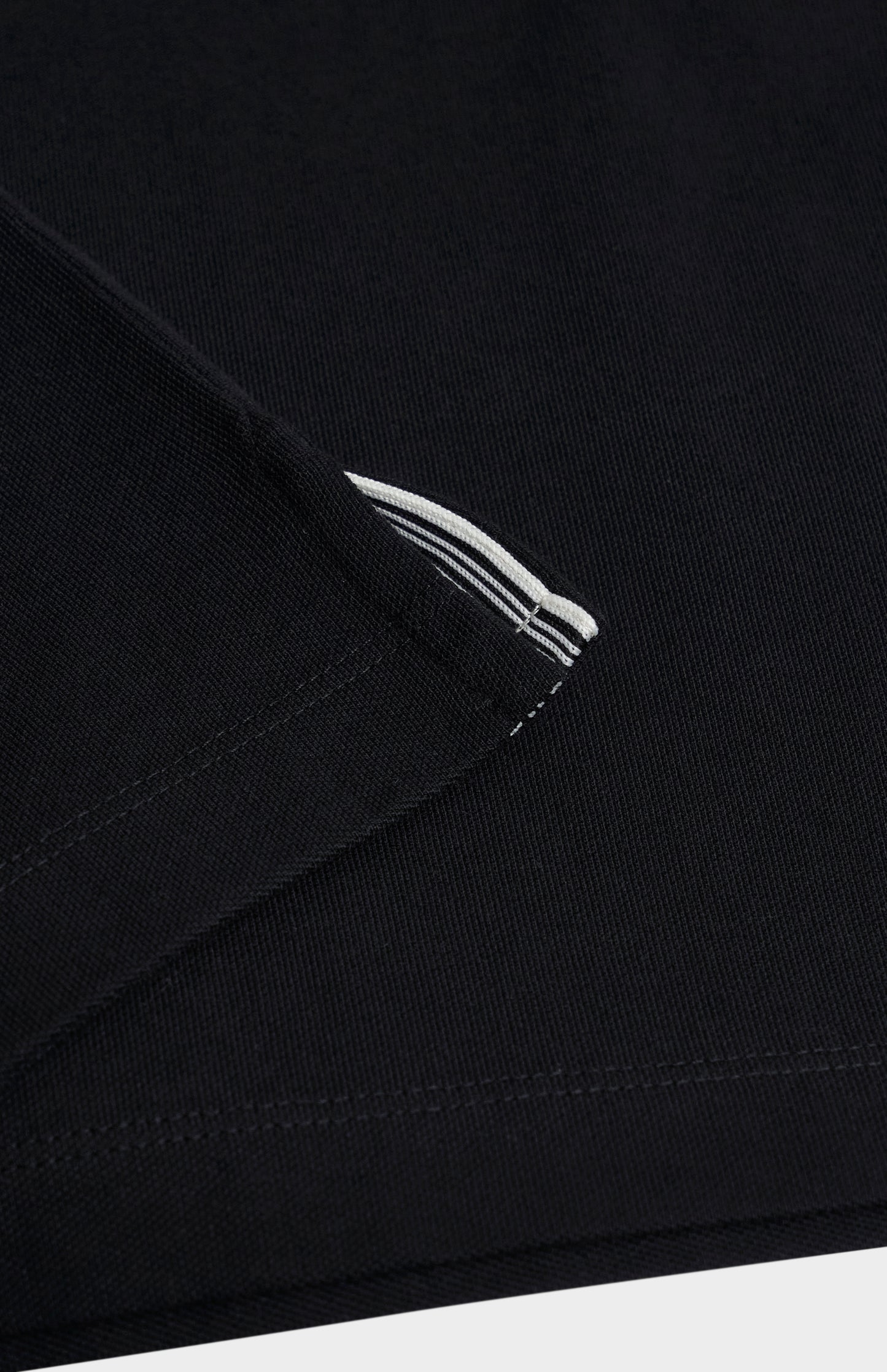 Close-up of a black fabric polo shirt